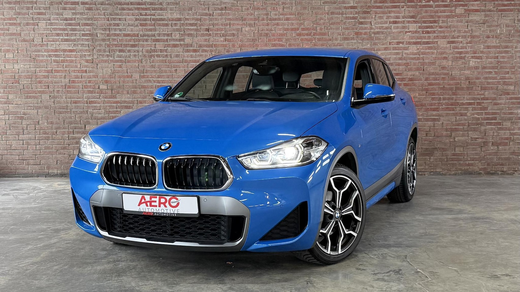 BMW X2 - sDrive18i High Executive M-Sport / Leder / Navi / Camera / ALLSEASON - AutoWereld.nl