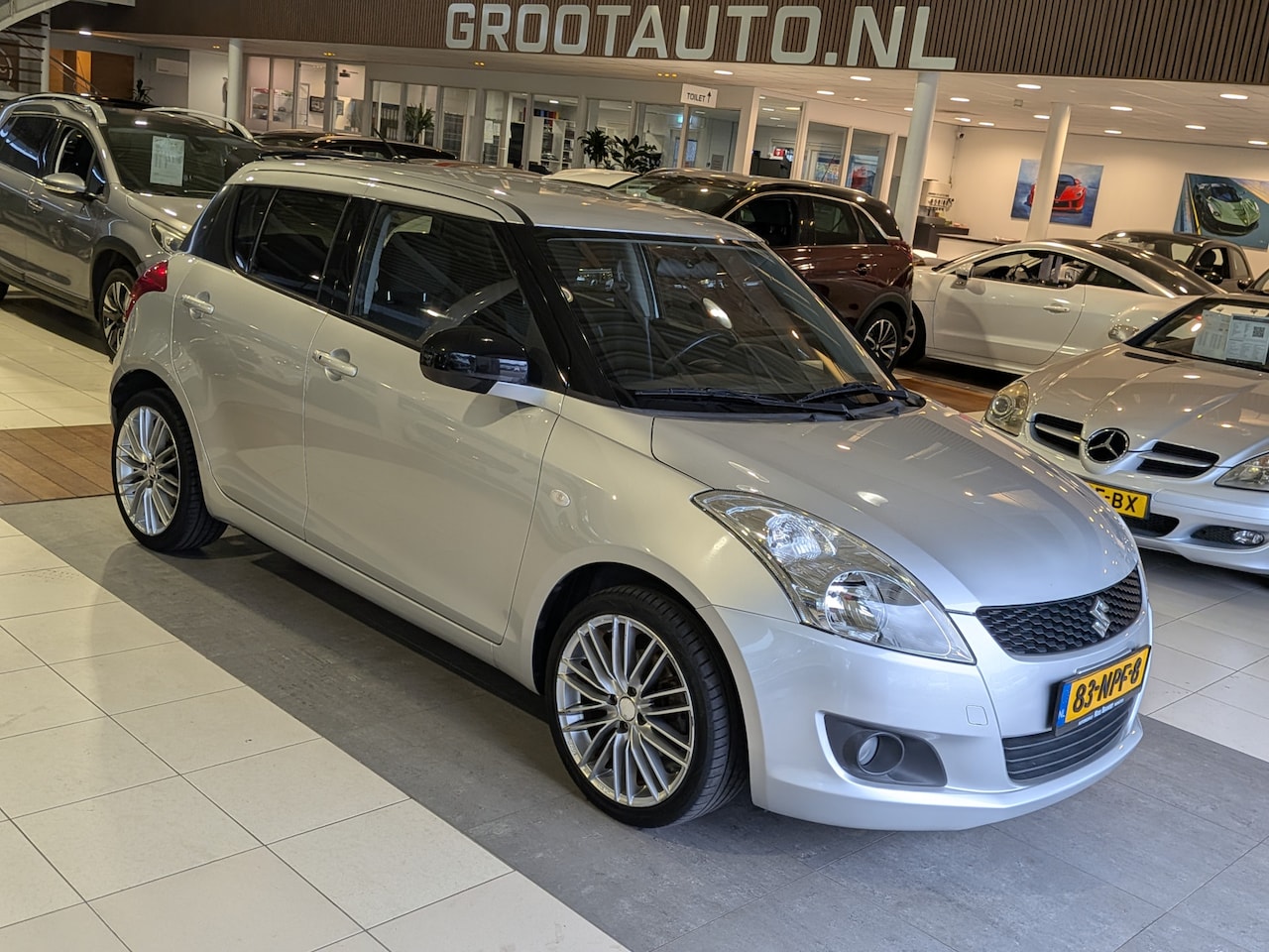 Suzuki Swift - 1.2 Exclusive EASSS Airco, Cruise Control, Stuurbekrachtiging - AutoWereld.nl