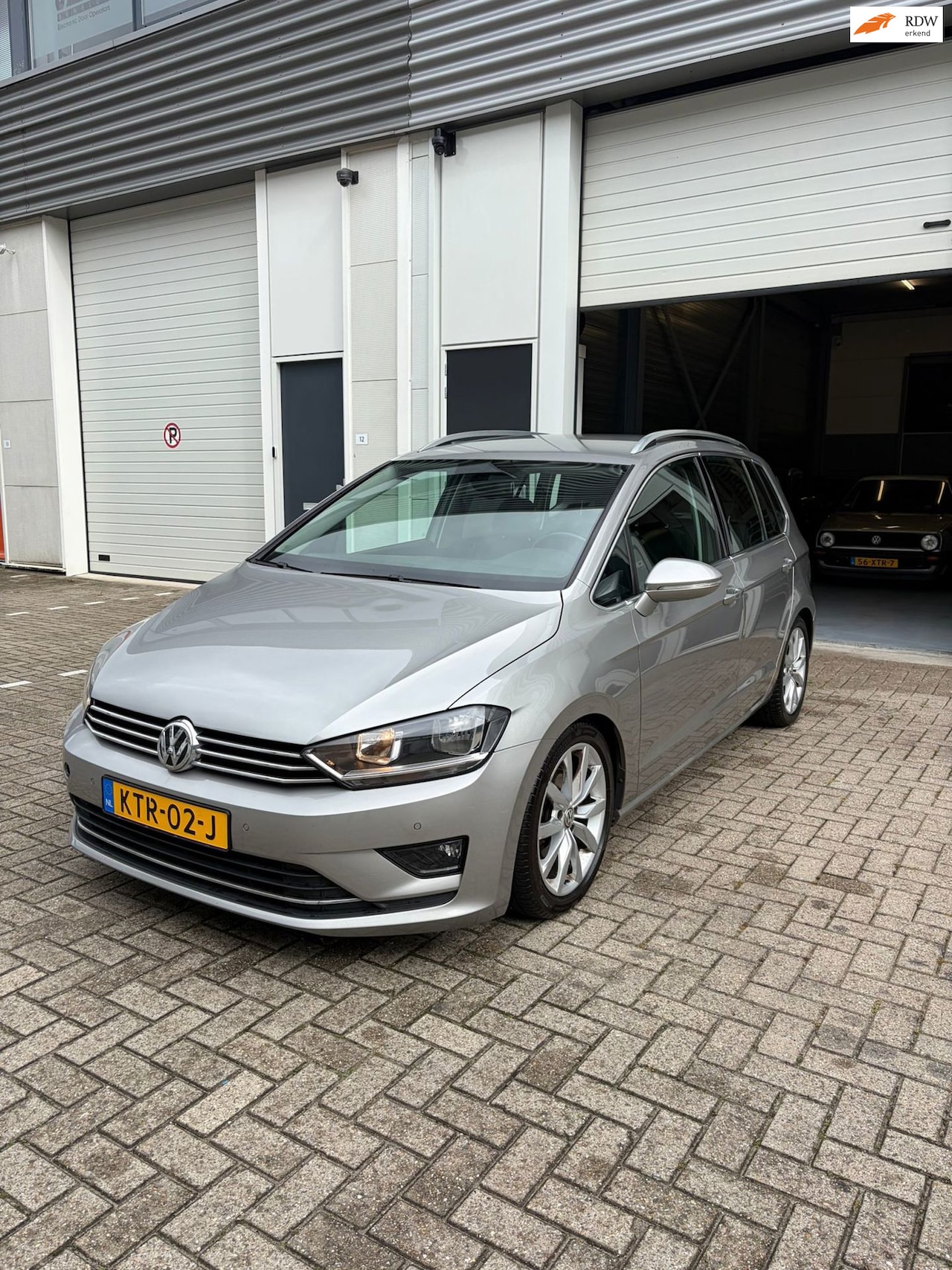Volkswagen Golf Sportsvan - 2.0 TDI Highline DSG 2015 - AutoWereld.nl
