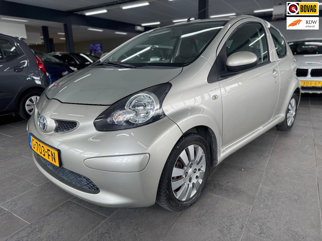 Toyota Aygo - 1.0-12V + airco elektrische pakket half leer lm-velgen 117 dzkm nap. - AutoWereld.nl