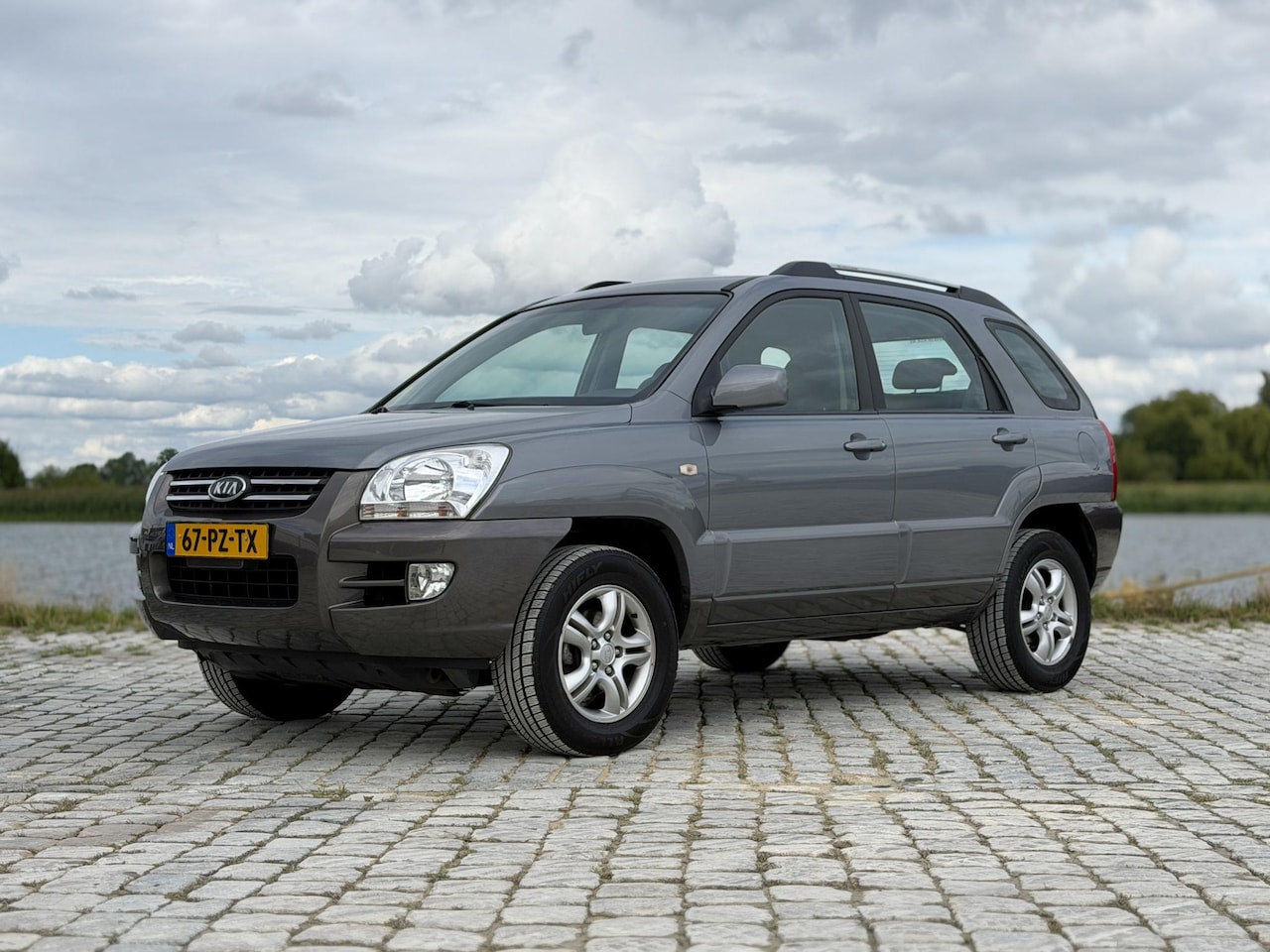 Kia Sportage - 2.0 CVVT Comfort|Cruise|Navi|Trekhaak - AutoWereld.nl