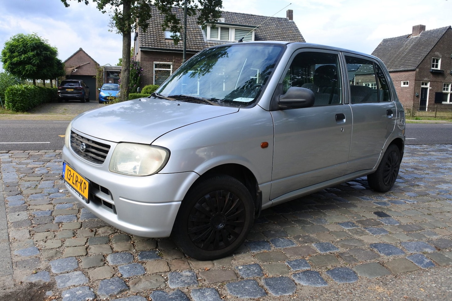Daihatsu Cuore - 1.0-12V DVVT STi 5 drs 135 dkm apk 26-8-2027 - AutoWereld.nl