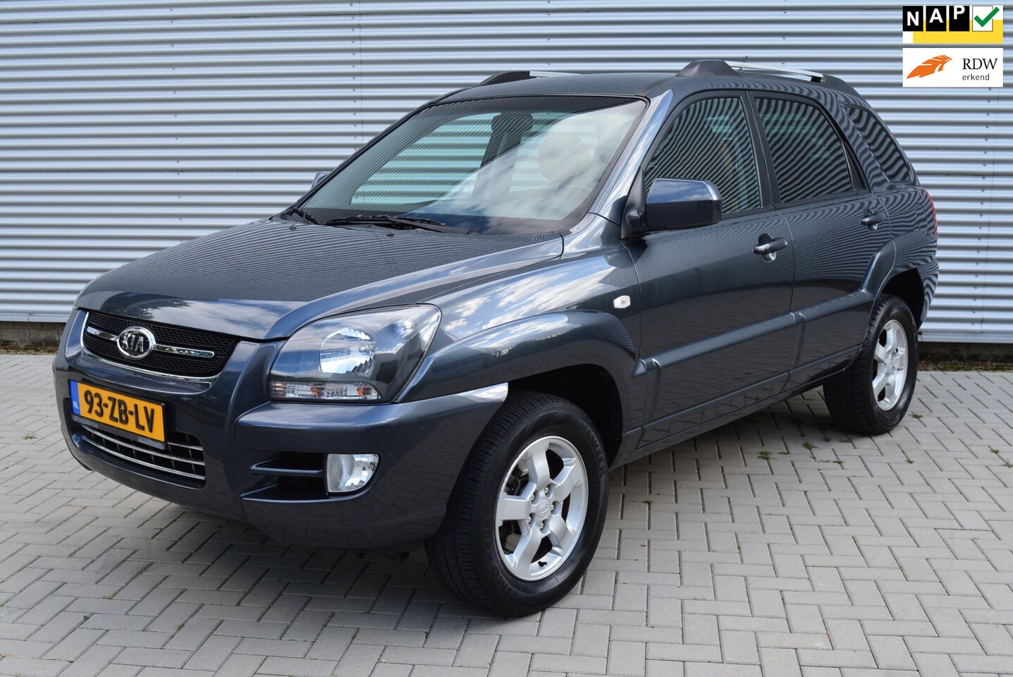 Kia Sportage - 2.0 CVVT X-ception | Airco | Leder | Navi | Cruise | L.M. Velgen. - AutoWereld.nl