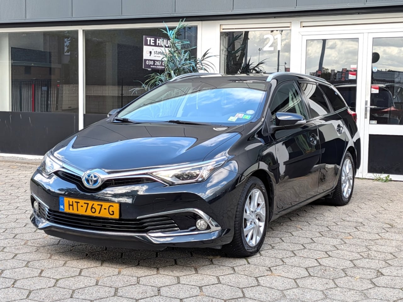 Toyota Auris Touring Sports - 1.8 Hybrid Lease Pro NAVI CLIMA KEYLESS CAMERA - AutoWereld.nl