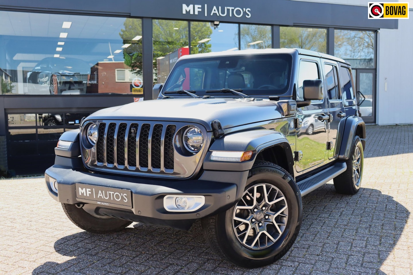 Jeep Wrangler Unlimited - 4xe 380 Sahara|Leder|360|ACC|Stuur & stoelverwarming|Led - AutoWereld.nl