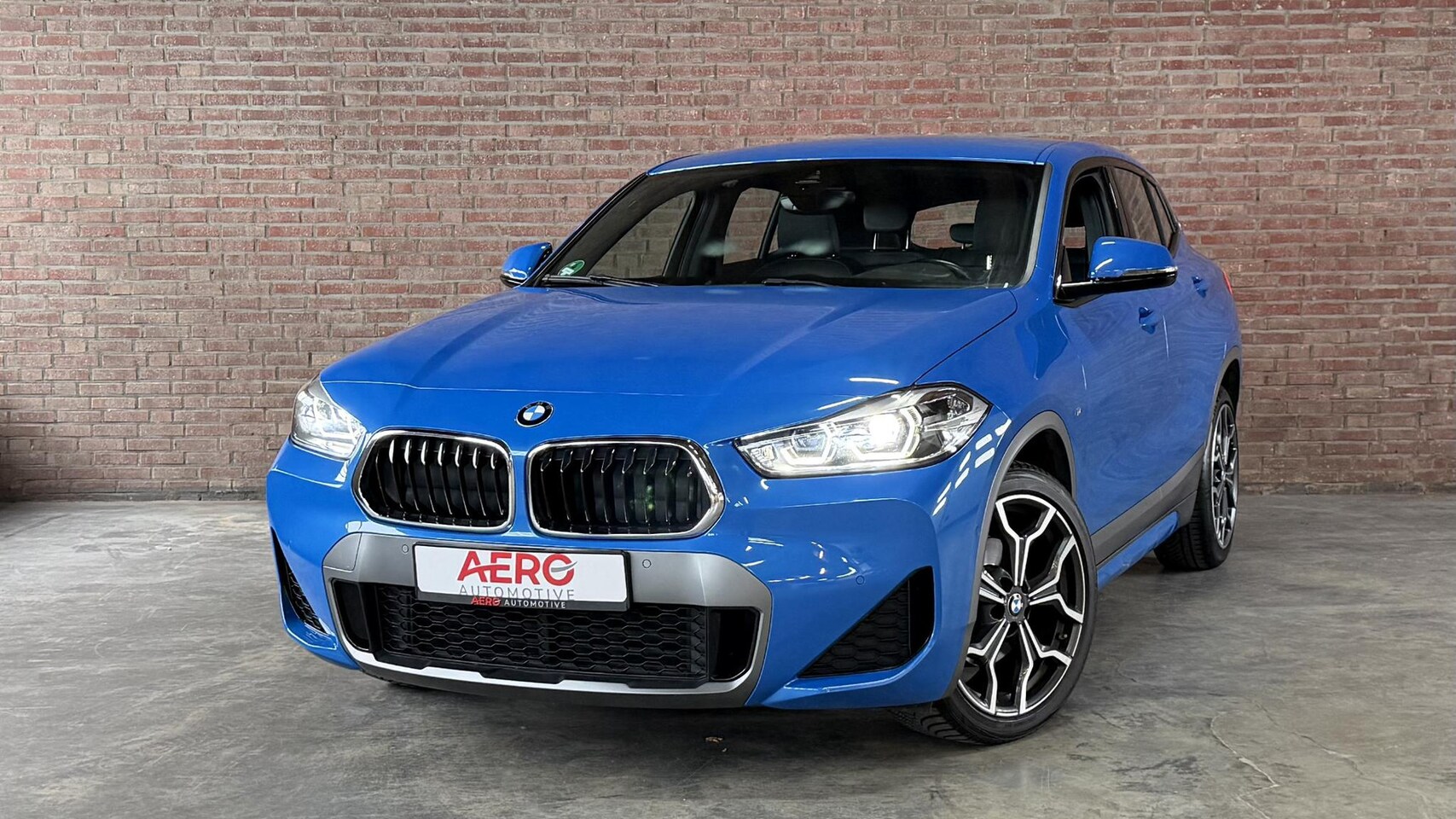 BMW X2 - sDrive18i High Executive M-Sport / Leder / Navi / Camera / ALLSEASON - AutoWereld.nl