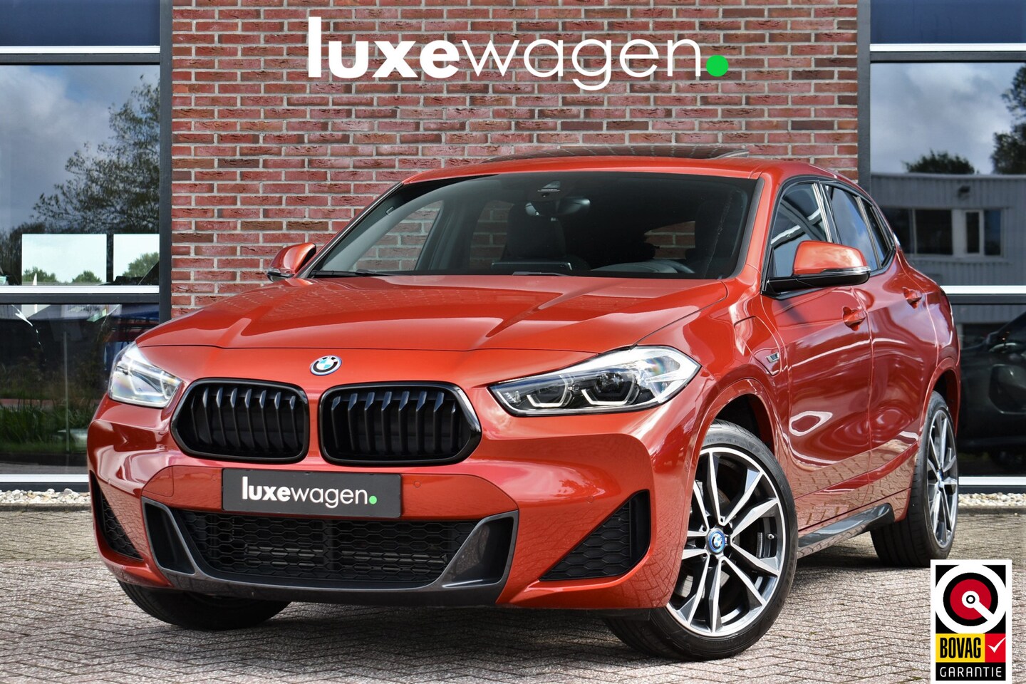 BMW X2 - xDrive25e M-Sport | Pano | HUD | Sunset orange | 19 inch | Camera - AutoWereld.nl