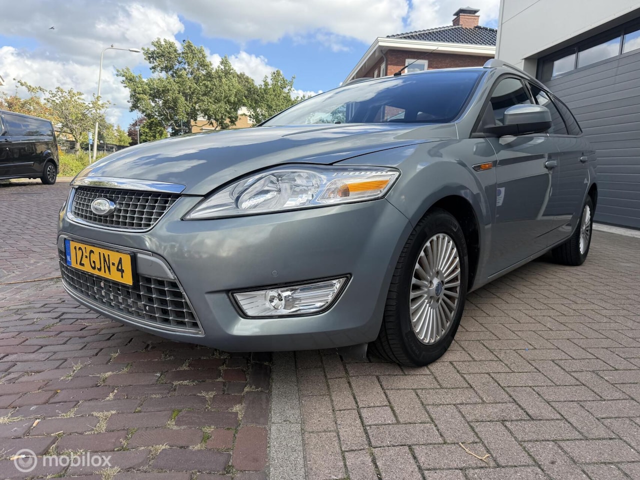 Ford Mondeo Wagon - 2.3-16V Titanium AUTOMAAT/NAVI/TREKHAAK - AutoWereld.nl