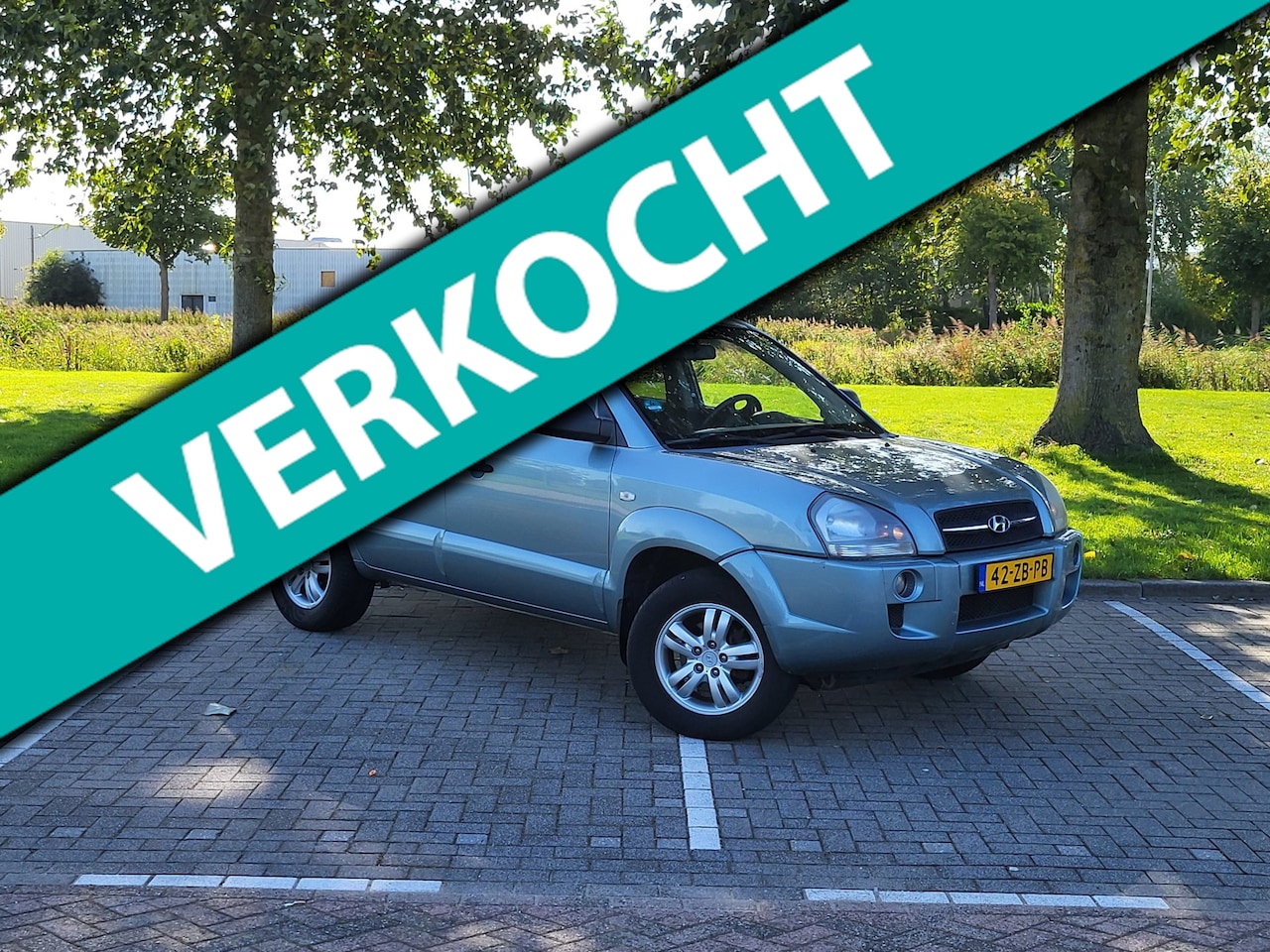 Hyundai Tucson - 2.0i Dynamic / Airco / Nap / Cruise control / Nieuwe Apk / Trekhaak - AutoWereld.nl