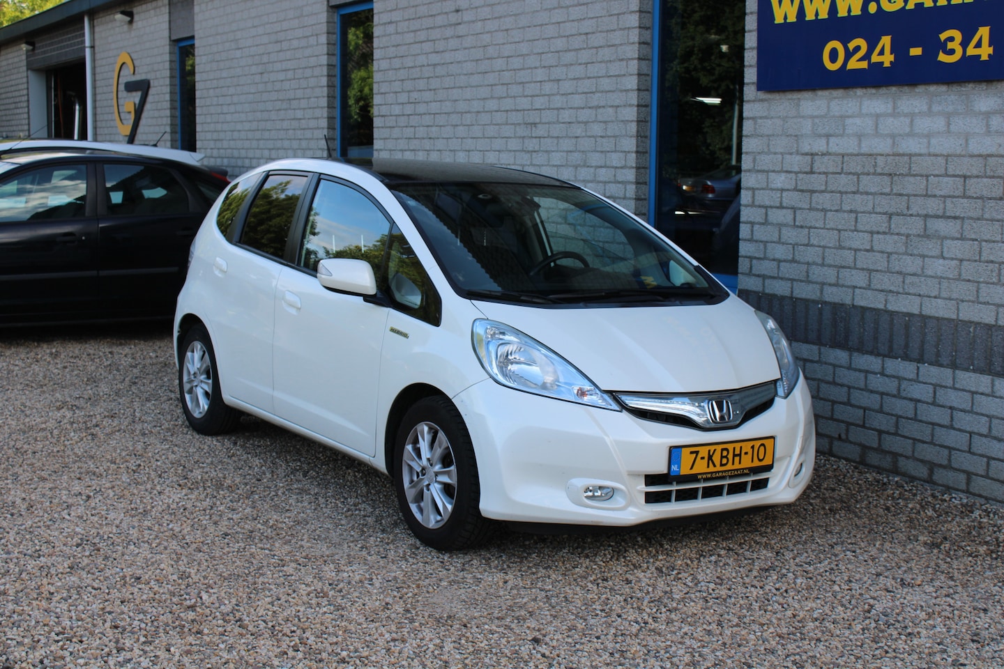 Honda Jazz - 1.4 Hybrid Elegance Trekhaak Navi Camera Panoramadak - AutoWereld.nl