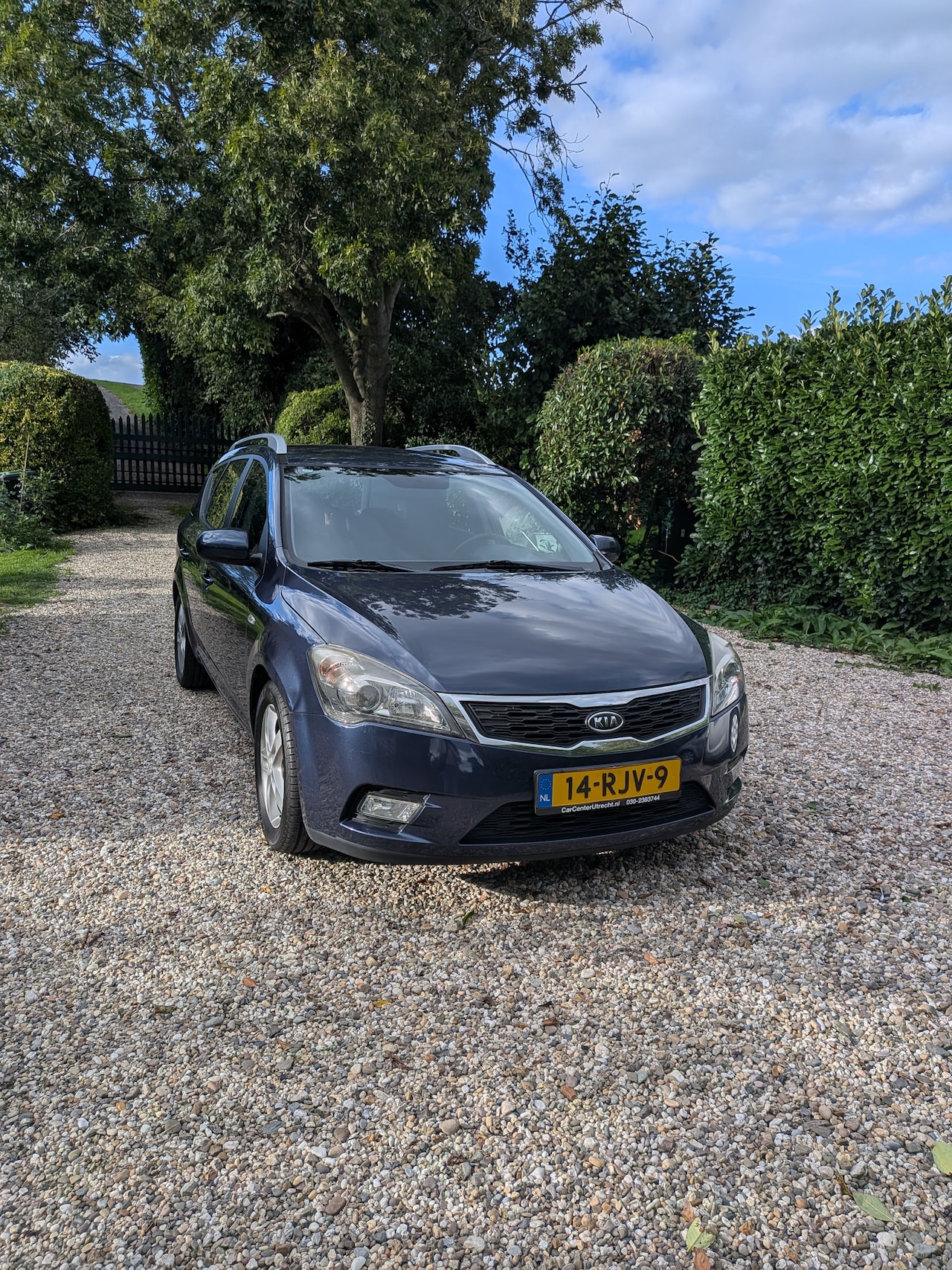 Kia Cee'd Sporty Wagon - 1.4 CVVT Seven - AutoWereld.nl