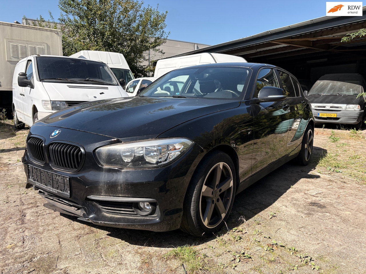 BMW 1-serie - 116i Sport - airco - stoelverwarming - AutoWereld.nl