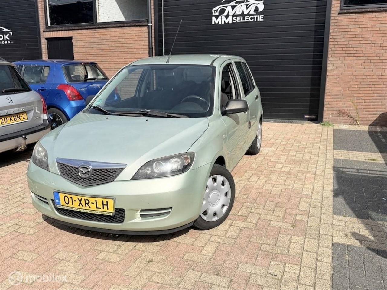 Mazda 2 - 1.4 Exclusive | NAP | 159.427 km | Airco | Trekhaak - AutoWereld.nl