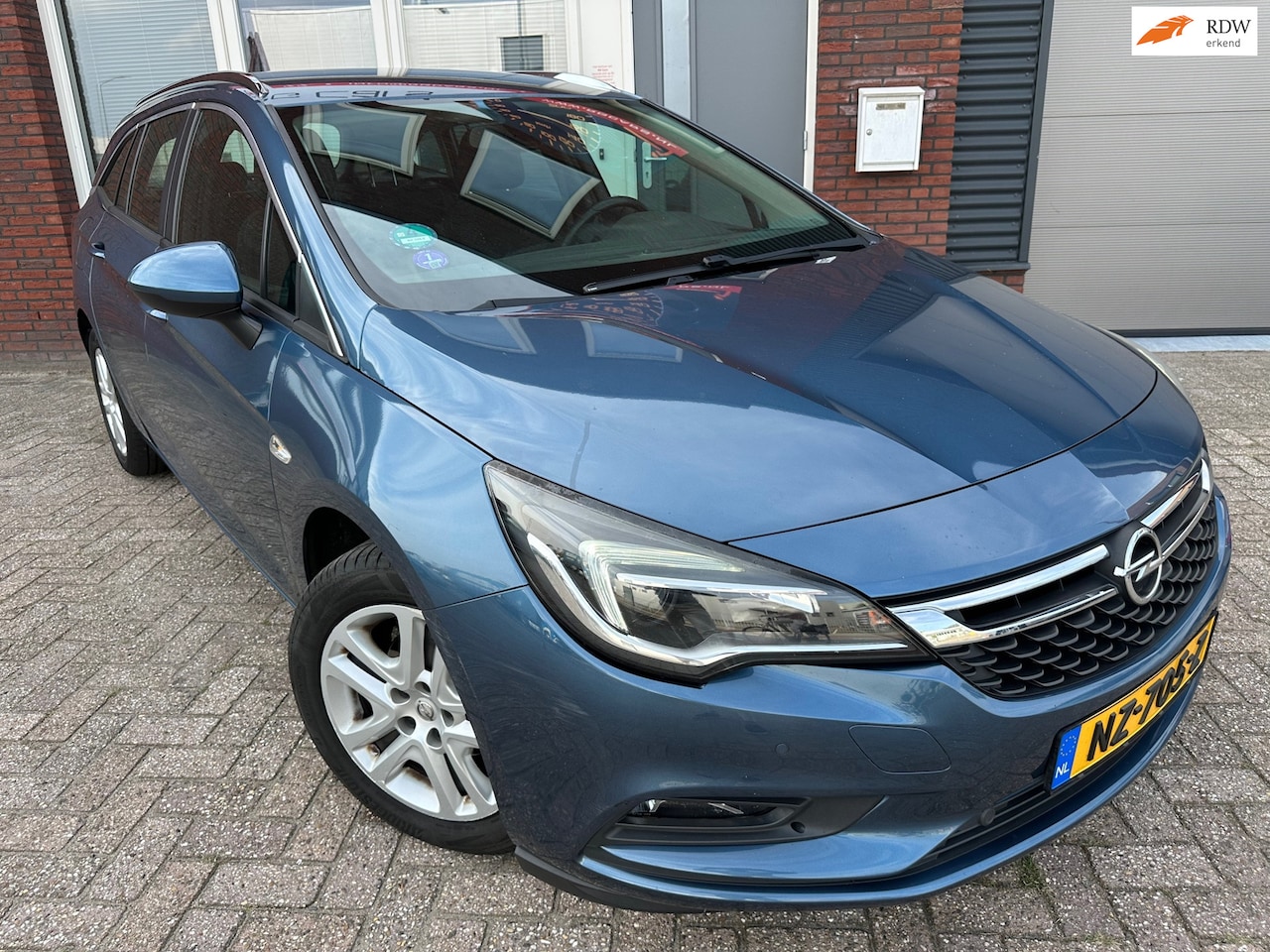 Opel Astra Sports Tourer - 1.4 Online Edition / Navi / Camera / PDC / DAB / NAP / Cruise - AutoWereld.nl