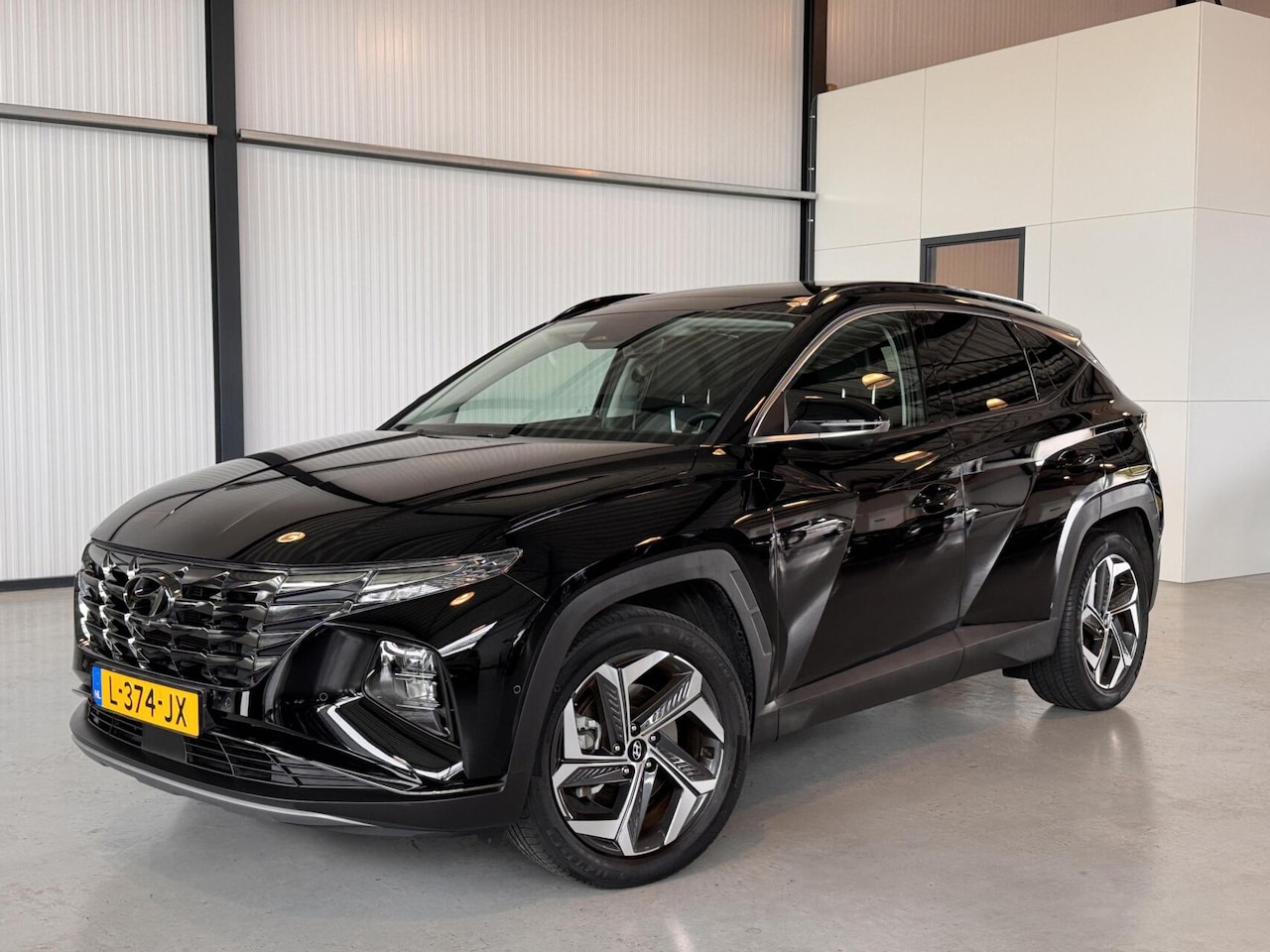 Hyundai Tucson - 1.6 T-GDI HEV Premium Sky 1.6 T-GDI HEV Premium Sky - AutoWereld.nl
