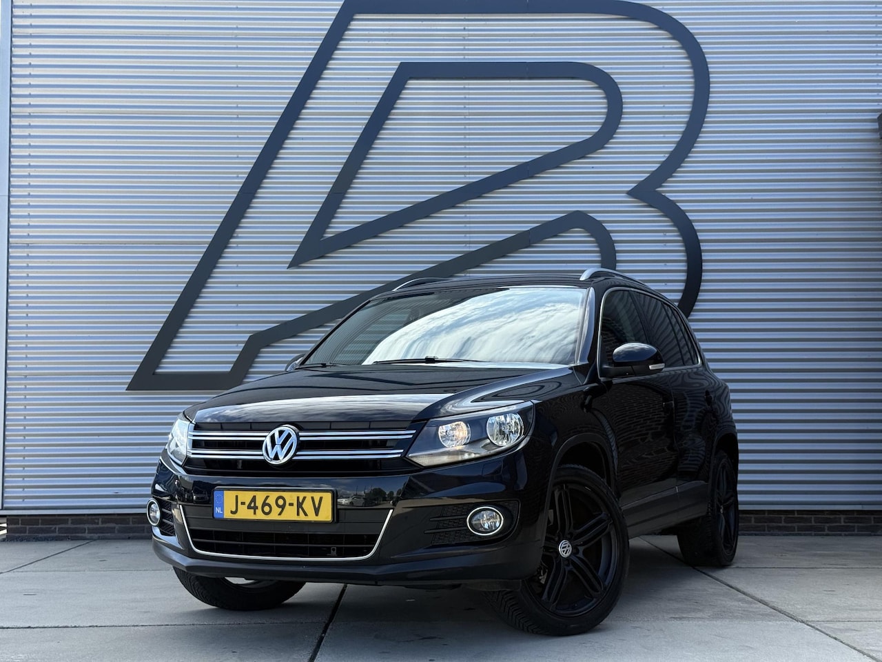 Volkswagen Tiguan - 2.0 TSI Sport&Style 4Motion 2e Eigenaar|Navi|Clima|Cruise|PDC|Trekhaak|Stoelverwarming|Nie - AutoWereld.nl