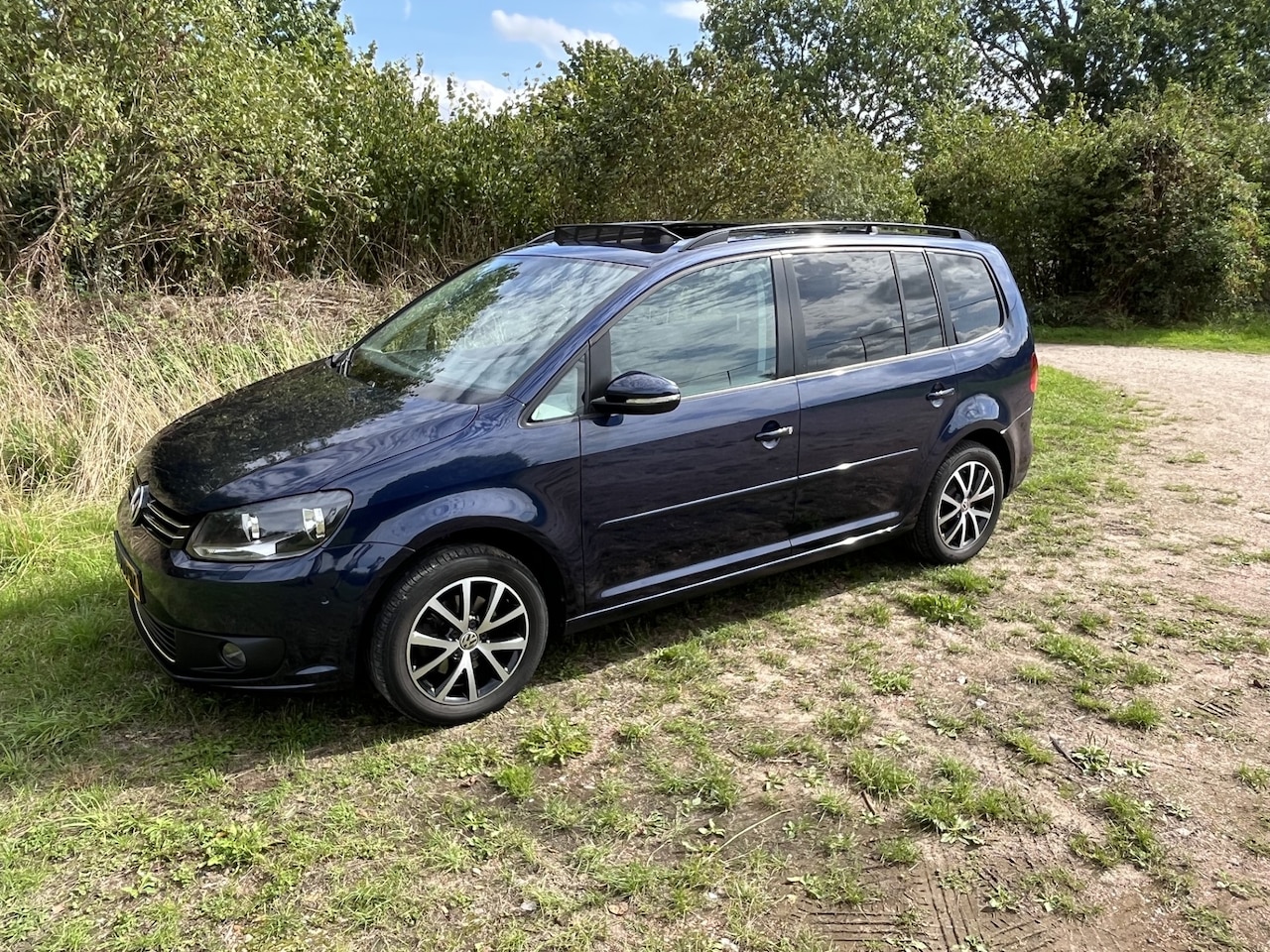 Volkswagen Touran - 1.4 TSI Highline 7p. PANORAMADAK - AutoWereld.nl