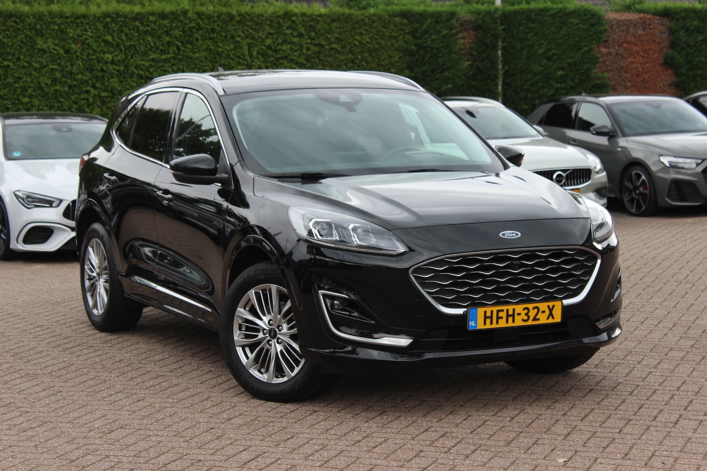 Ford Kuga - 2.5 PHEV Vignale / SoH 91,1% / Trekhaak / Camera / Leder / Head-up / B&O / 18'' / Matrix L - AutoWereld.nl