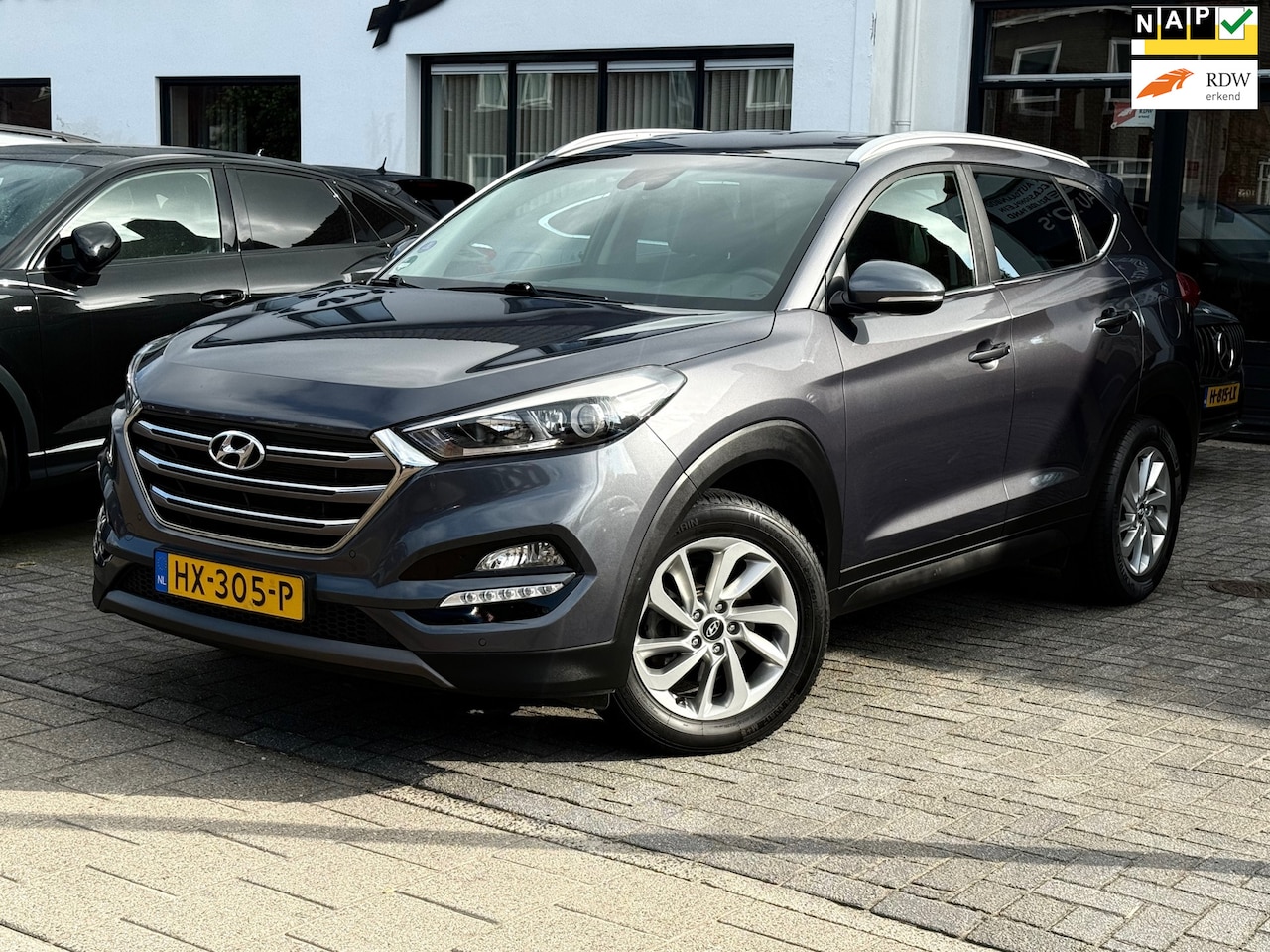 Hyundai Tucson - 1.6 GDI Comfort 1.6 GDi Comfort, Trekhaak,Stoelverwarming,Navigatie,Achteruitrij camera - AutoWereld.nl