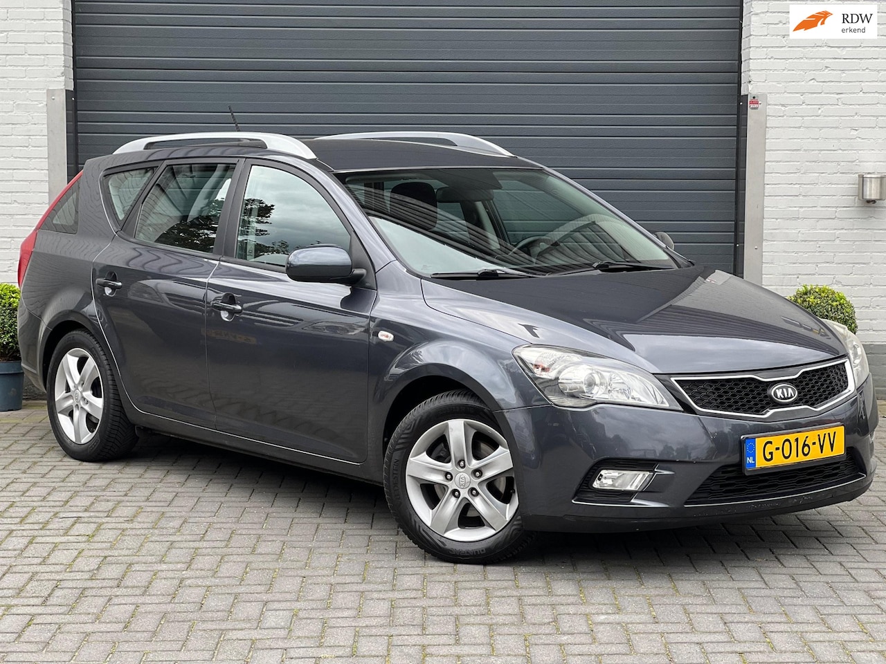 Kia Cee'd Sporty Wagon - 1.4 CVVT | Airco | Cruise | Trekhaak | PDC | Stoelverw. | Camera | - AutoWereld.nl