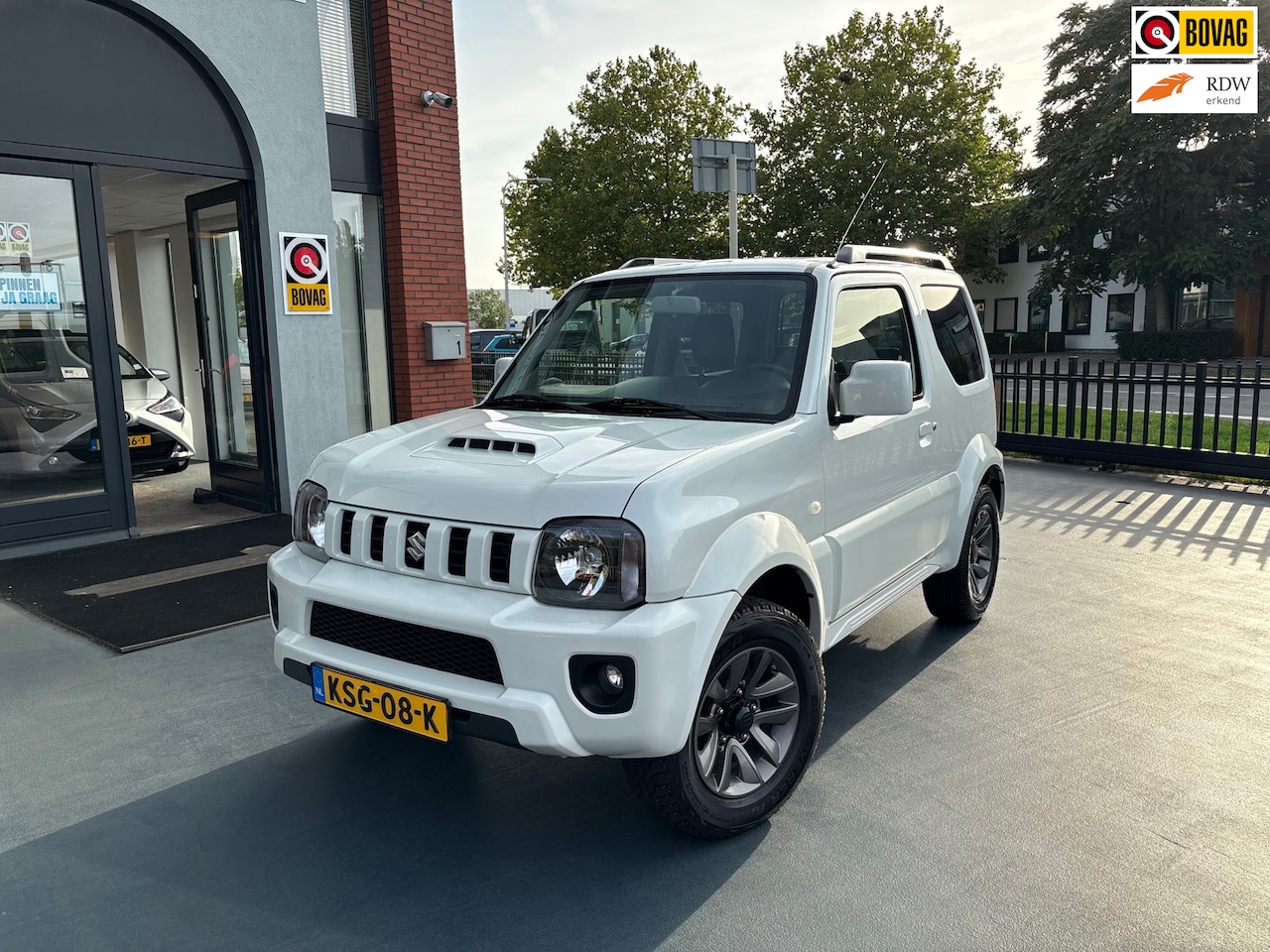 Suzuki Jimny - 1.3 Exclusive LEDER STOELVERWARMING AIRCO LMV - AutoWereld.nl