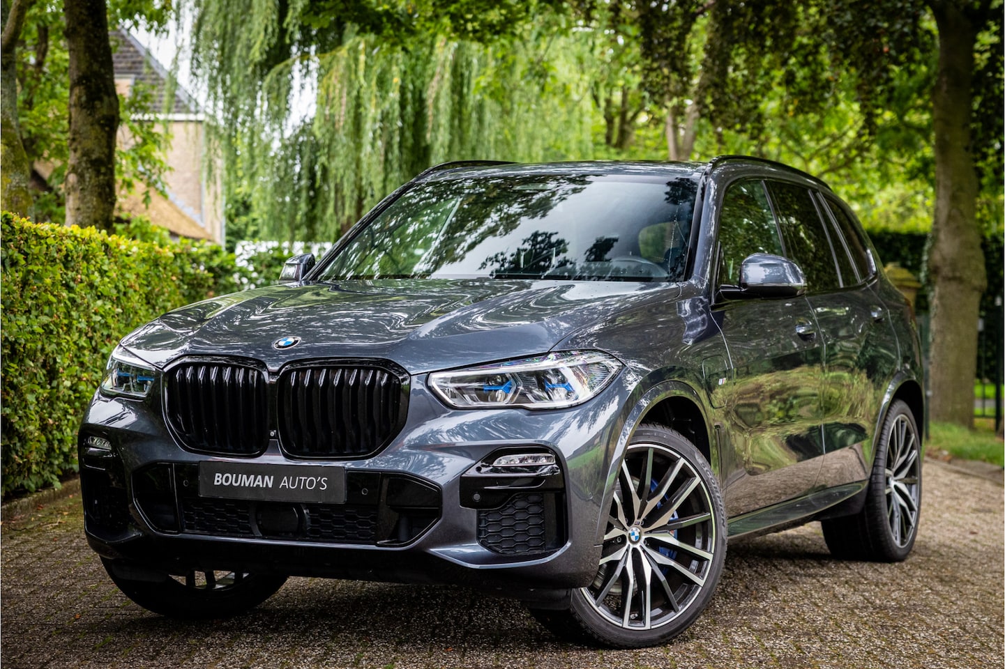 BMW X5 - xDrive45e M Sport Sky Lounge Laser Soft Close 22" Vierwielbesturing Harman Kardon Skyloung - AutoWereld.nl