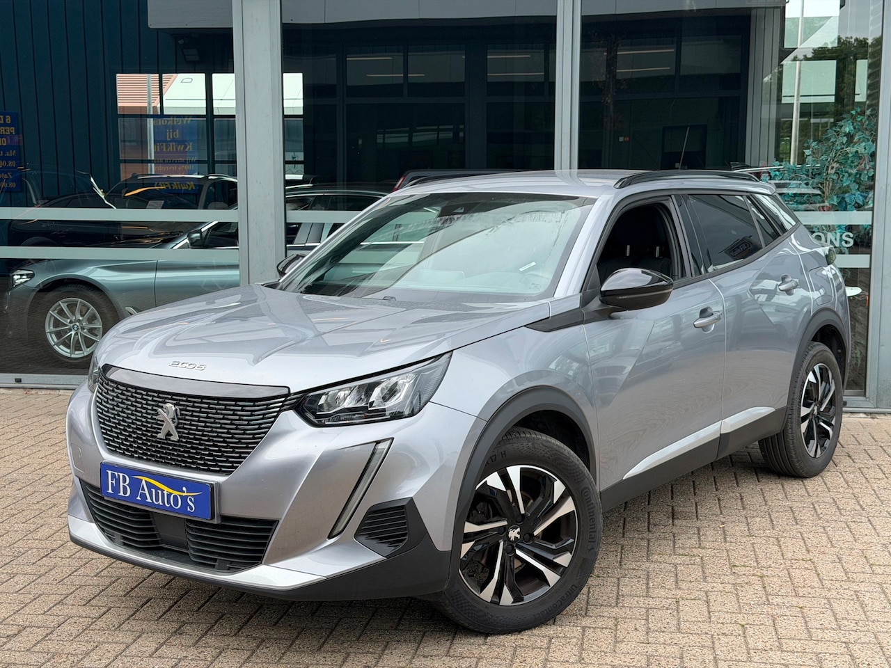 Peugeot 2008 - 1.2 PureTech Allure Pack Airco Lmv Cruise Camera - AutoWereld.nl
