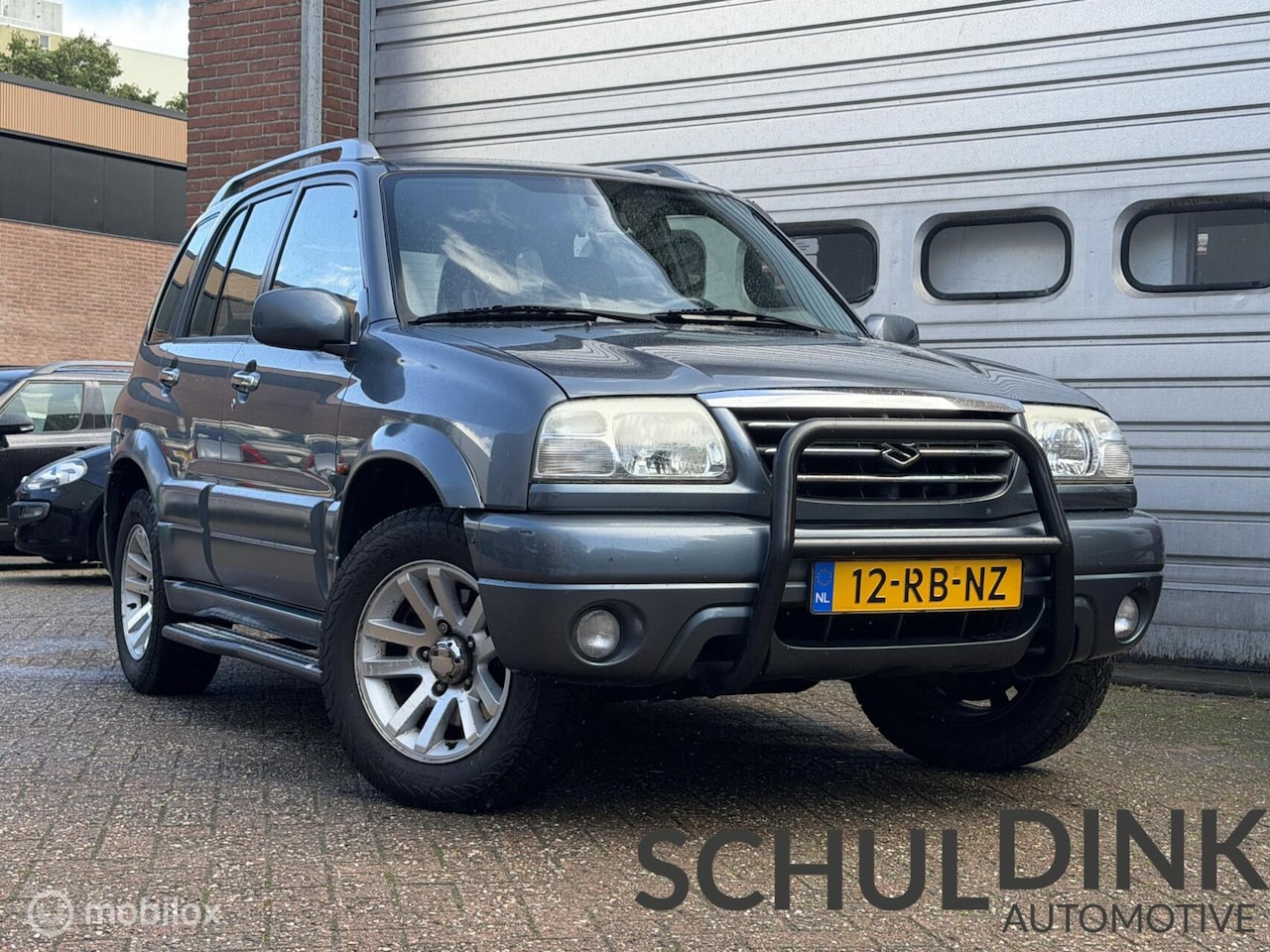 Suzuki Grand Vitara - 2.0 FreeStyle-3 4x4 AIRCO|LEDER|TREKHAAK - AutoWereld.nl