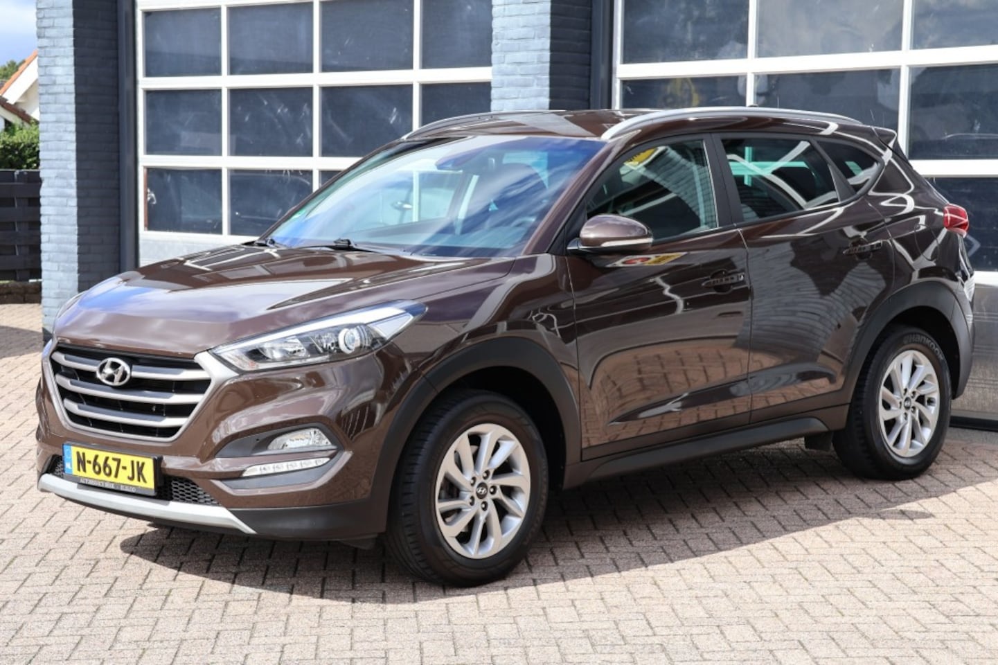 Hyundai Tucson - 1.6 Gdi i-motion navigatie,camera, trekhaak - AutoWereld.nl