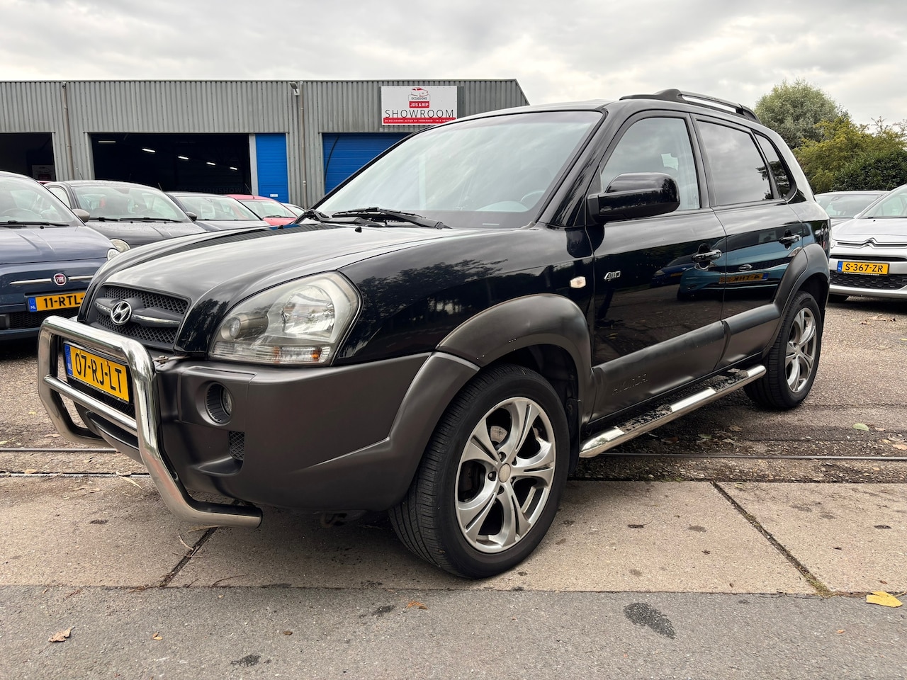 Hyundai Tucson - 2.7i V6 4WD Style 2.7i V6 4WD Style - AutoWereld.nl
