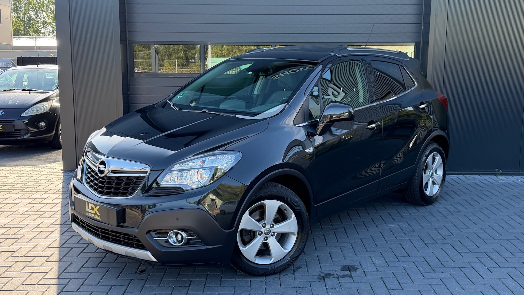 Opel Mokka - 1.4 T Cosmo 4x4 Airco|Trekhaak|Cruise|Camera - AutoWereld.nl