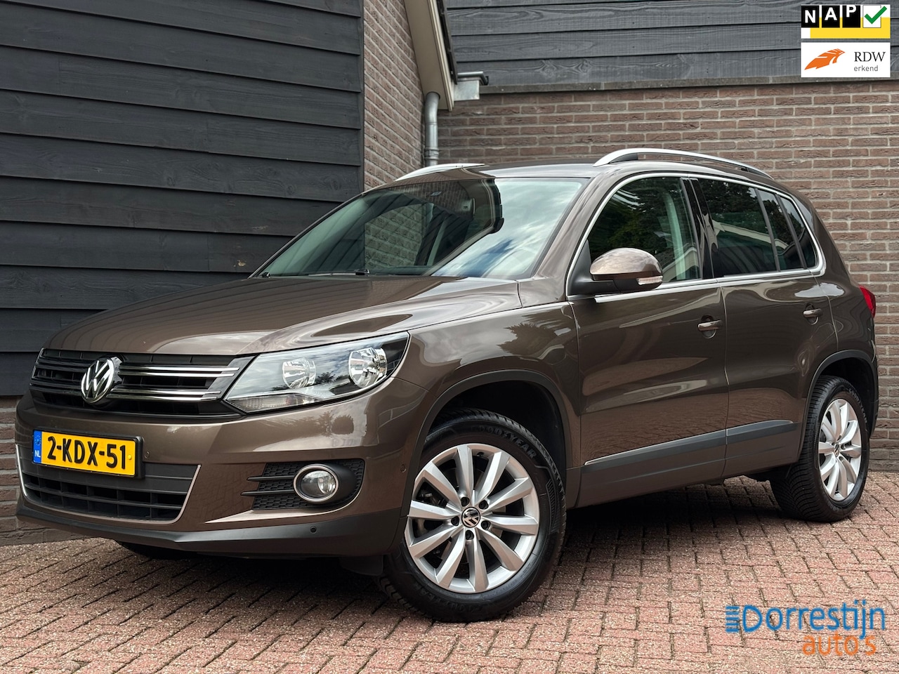 Volkswagen Tiguan - 1.4 TSI Sport&Style | Navi | PDC | Cruise | Eerste eigenaar - AutoWereld.nl