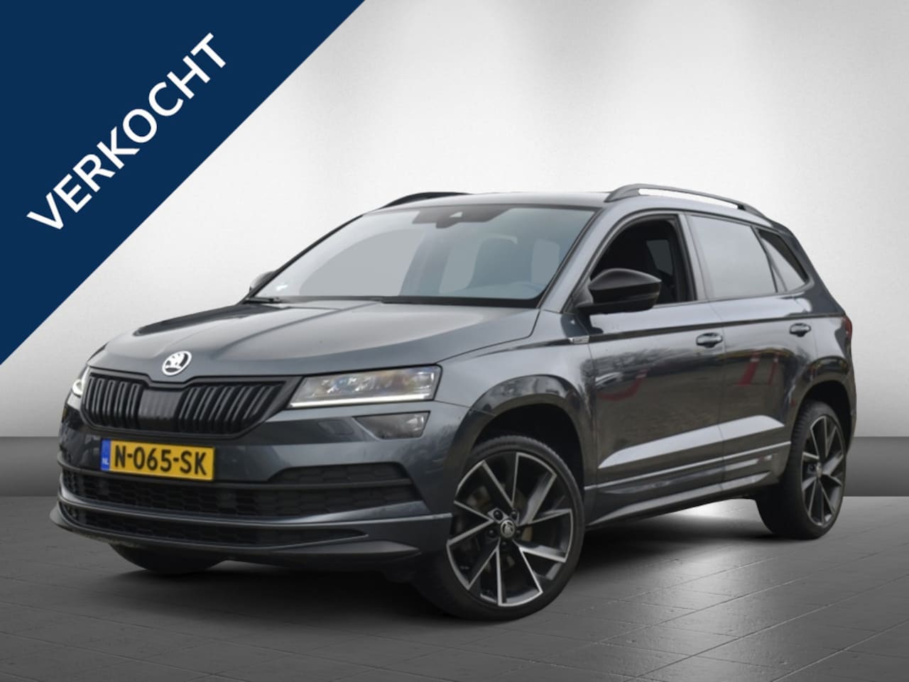 Skoda Karoq - 1.5 TSI Sportline Busines | trekhaak | camera |stuurverwarming - AutoWereld.nl
