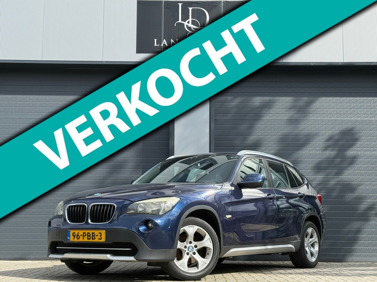 BMW X1 - SDrive18i Executive / LAGE KM / PDC / AIRCO / NAVI - AutoWereld.nl