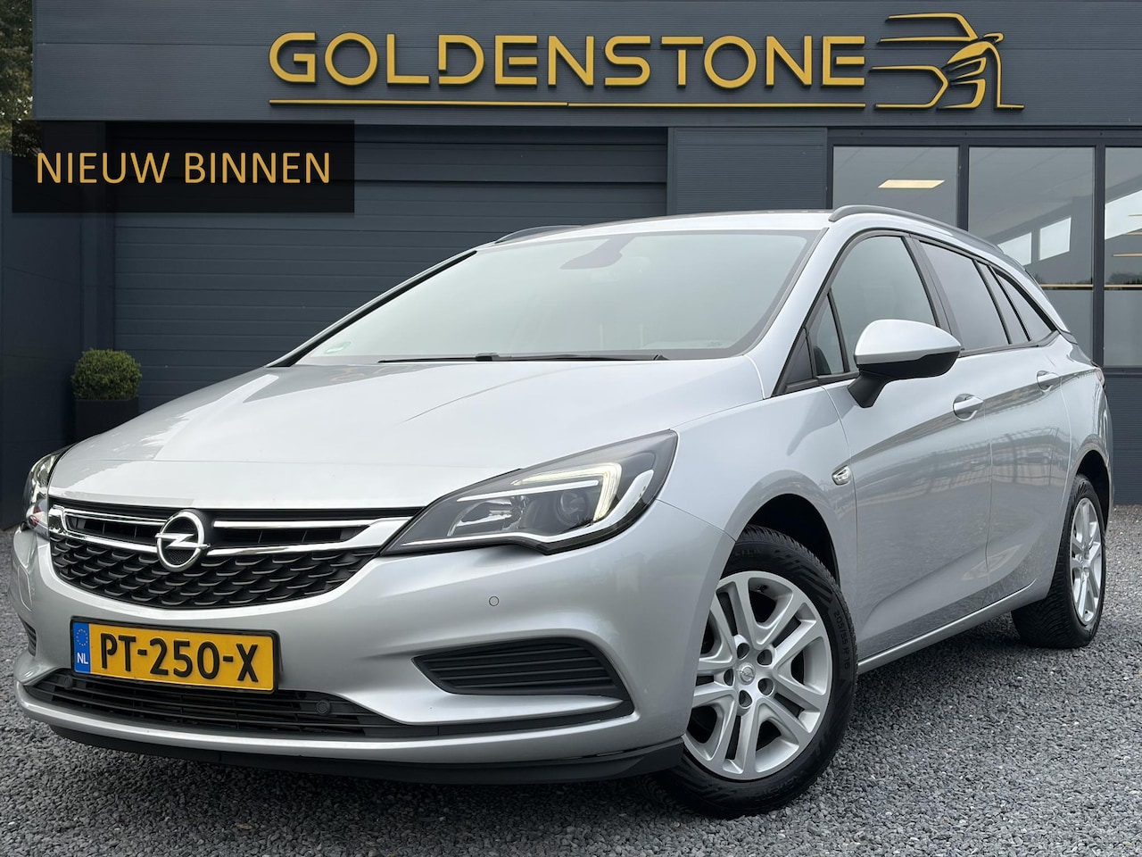 Opel Astra Sports Tourer - 1.0 Online Edition ✓2e Eigenaar✓Carplay✓Navi✓Trekhaak✓Net beurt gehad✓Clima✓Cruise✓Pdc V+A - AutoWereld.nl