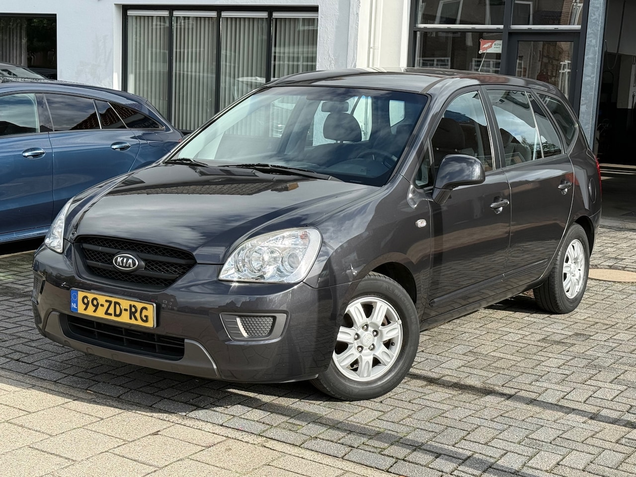 Kia Carens - 2.0 CVVT X-tra 7p. Airco, Elektr. ramen en spiegels,L.M.Velgen,Stuurbekrachtiging - AutoWereld.nl