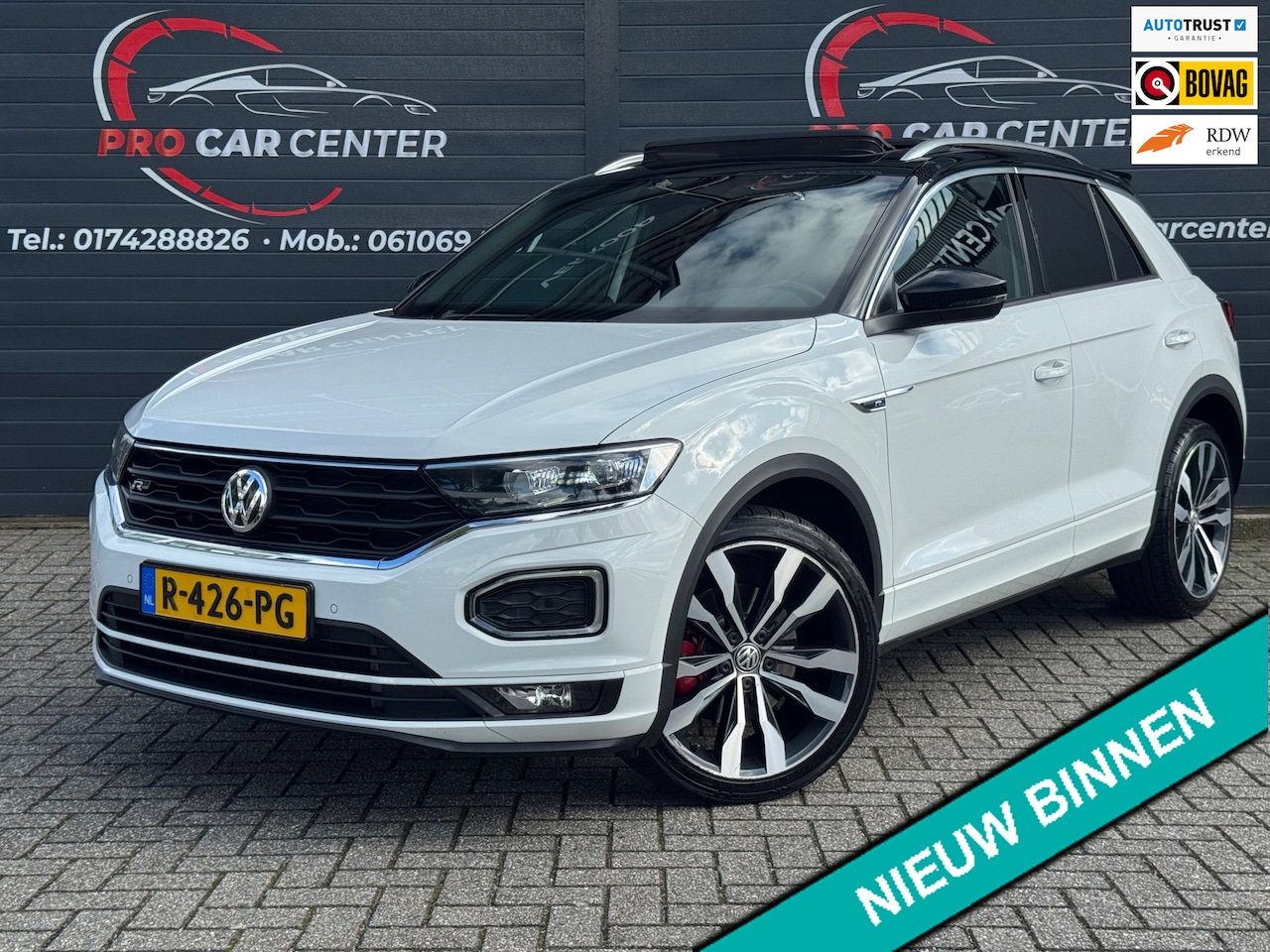 Volkswagen T-Roc - 2.0 TSI 4Motion Sport 3xR-Line Aut | Pano | Virtual | Cam | Stoel.ver | Lane-Front ass| El - AutoWereld.nl