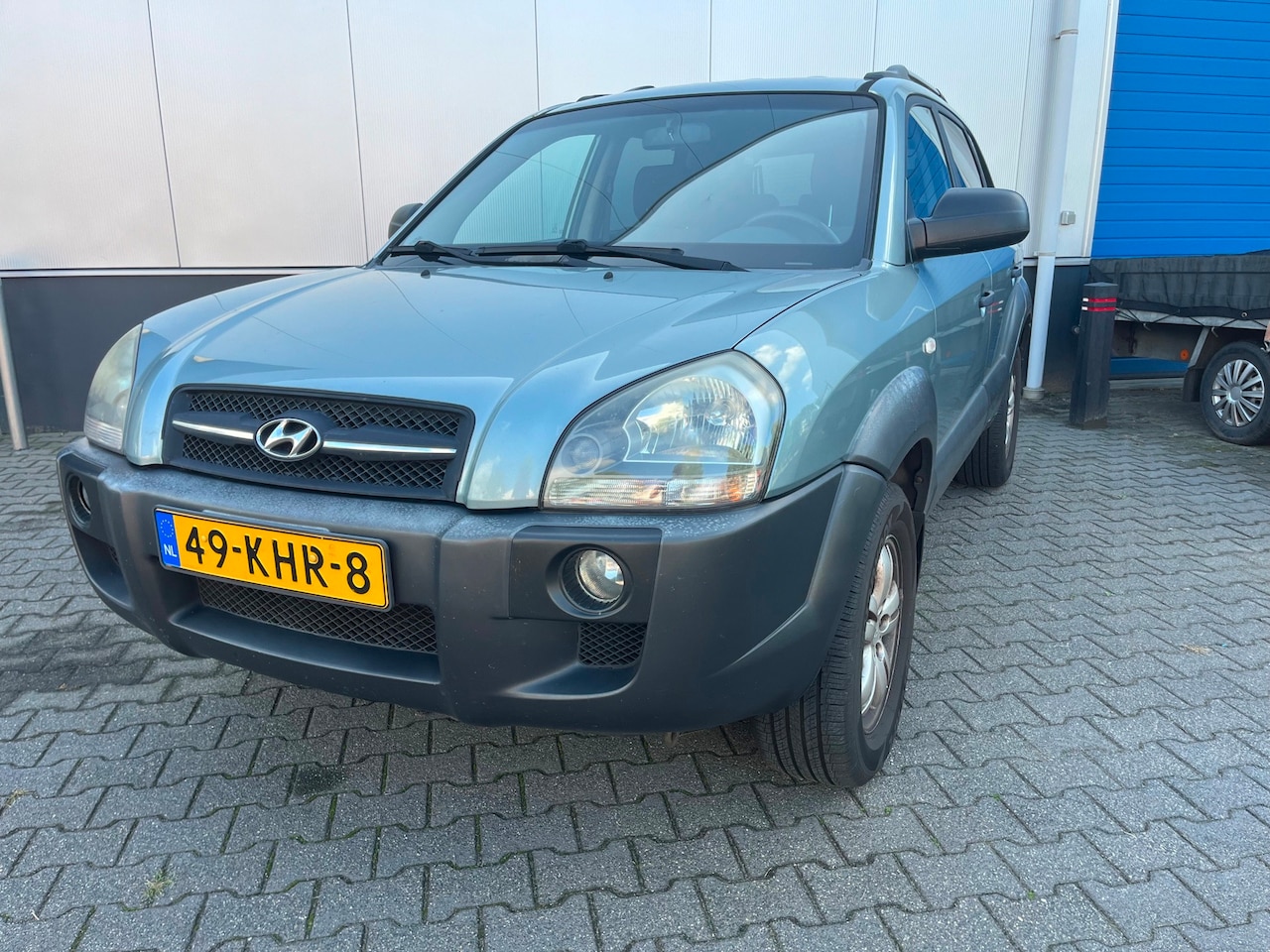 Hyundai Tucson - 2.0i 141pk Dynamic / Airco / Trekhaak max. 1.400kg / Cruise control / LM 16"/ Compleet ond - AutoWereld.nl