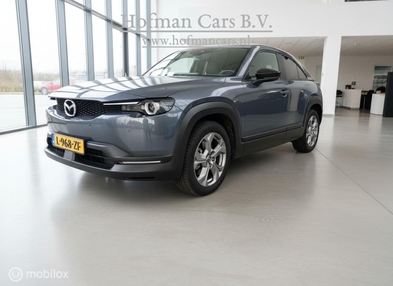 Mazda MX-30 - e-SkyActiv 145 36 kWh | Grijs | SOH 95,75% | MOBA | Stoel- & Stuurverwarming - AutoWereld.nl