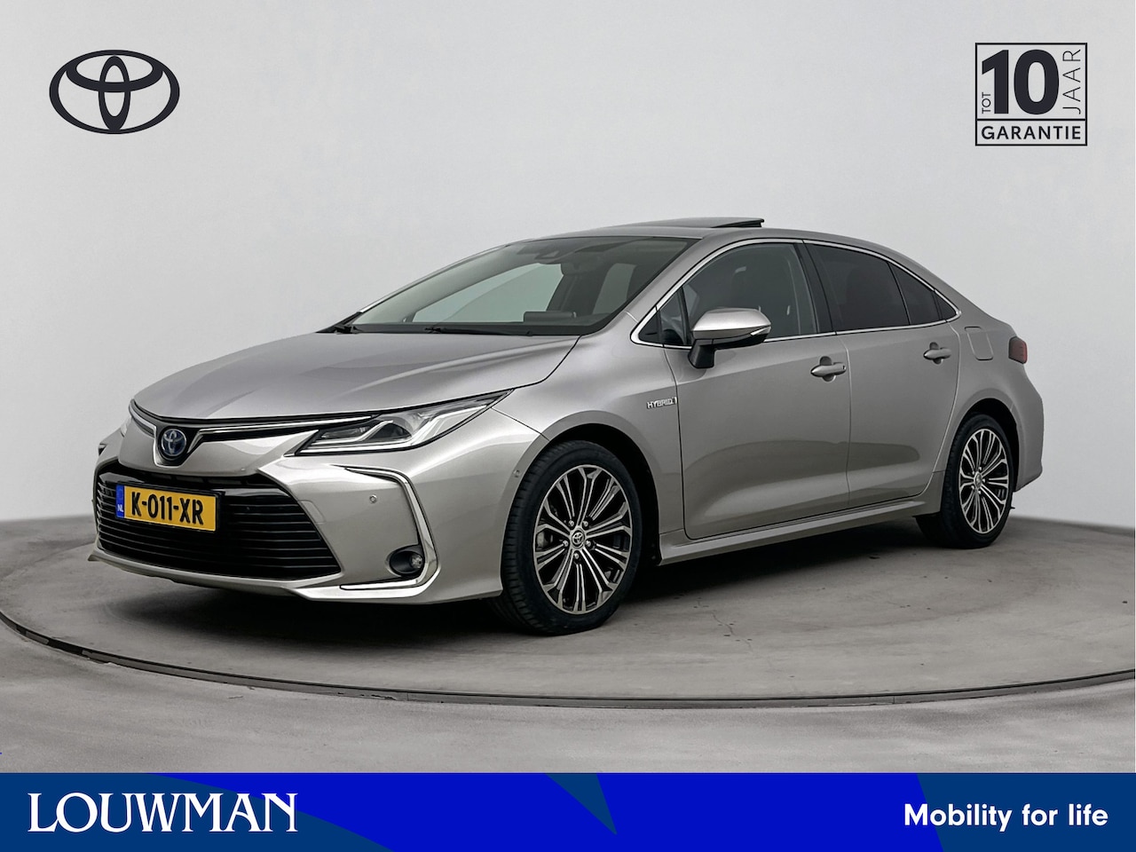 Toyota Corolla - 1.8 Hybrid Executive | Navigatie | Glazen Schuifdak | Half Leder | Stoel & Stuur Verwarmin - AutoWereld.nl