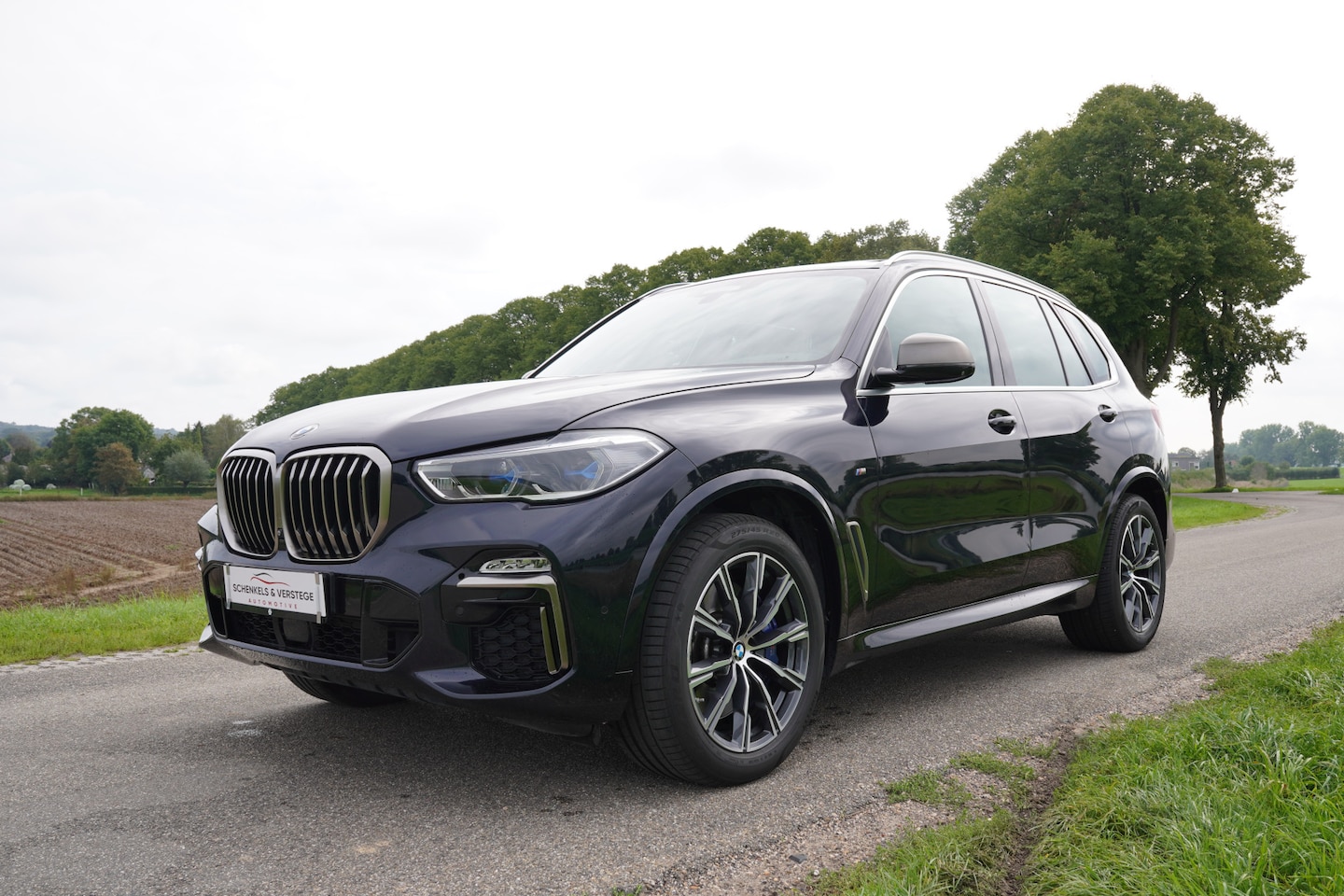 BMW X5 - M50d High Executive / Sky Lounge / Rear Seat Ent / Achteras besturing / Trekhaak / Co Pilo - AutoWereld.nl