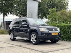 Suzuki Grand Vitara - 2.4 Exclusive |4WD|AUTOMAAT|CLIMA|LEDER|LM VELGEN|TREKHAAK| APK TOT 30-06-2027|