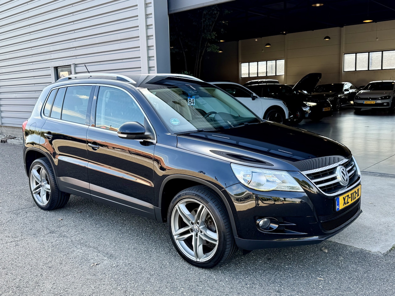 Volkswagen Tiguan - 1.4 TSI Sport&Style Clima|Cruis|Carplay Zwart - AutoWereld.nl