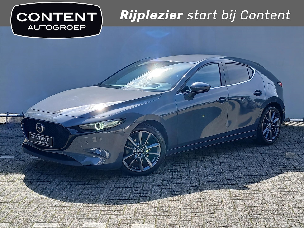 Mazda 3 - Hatchback Luxury edition / All-seasons / Navi / Cruise / Climate - AutoWereld.nl
