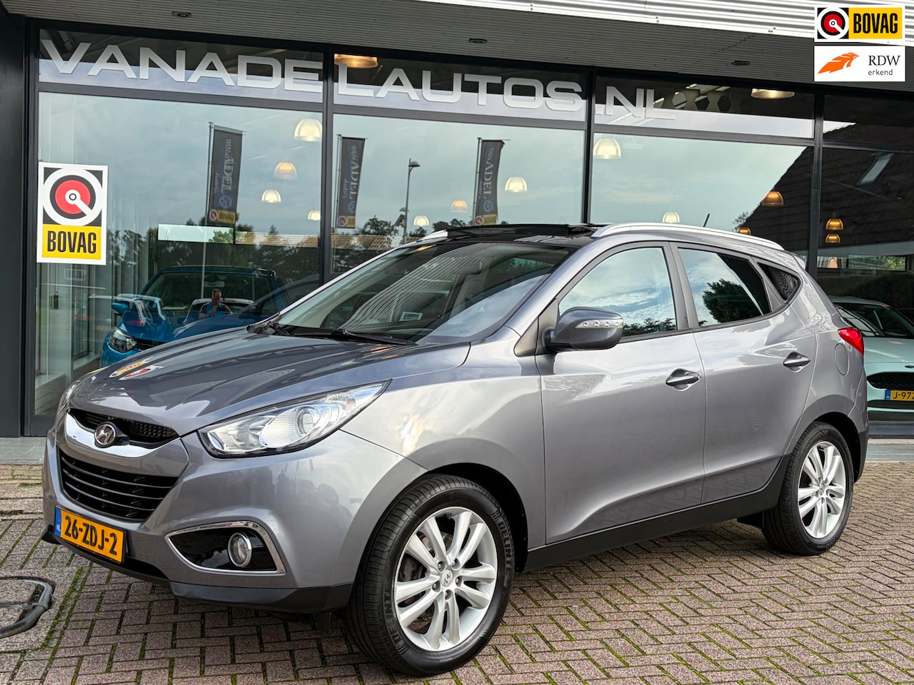 Hyundai ix35 - 2.0i i-Catcher Aut. Panorama Leer Navi Clima Cruise Camera Dealeronderhouden! - AutoWereld.nl