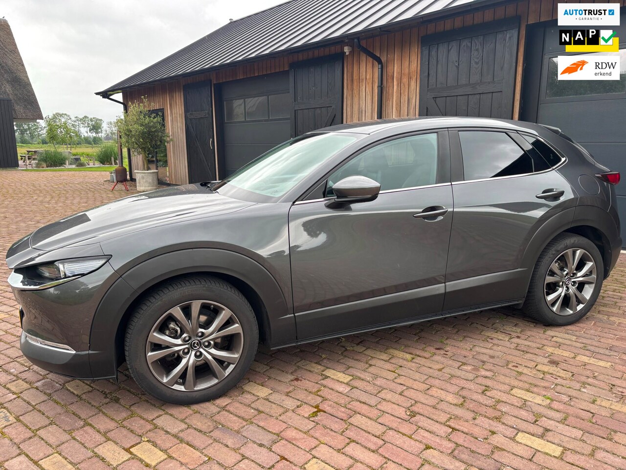 Mazda CX-30 - 2.0 e-SkyActiv-X M Hybrid Luxury ,CAMERA ,HUD,MEMORY STOELEN, TREKHAAK. - AutoWereld.nl