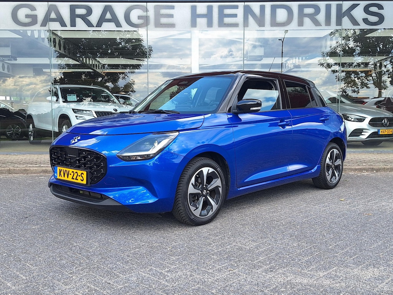 Suzuki Swift - 1.2 Style | Navi | Adaptive Cruise | LED |  Climate | Camera | Blindspot | Two-Tone | - AutoWereld.nl