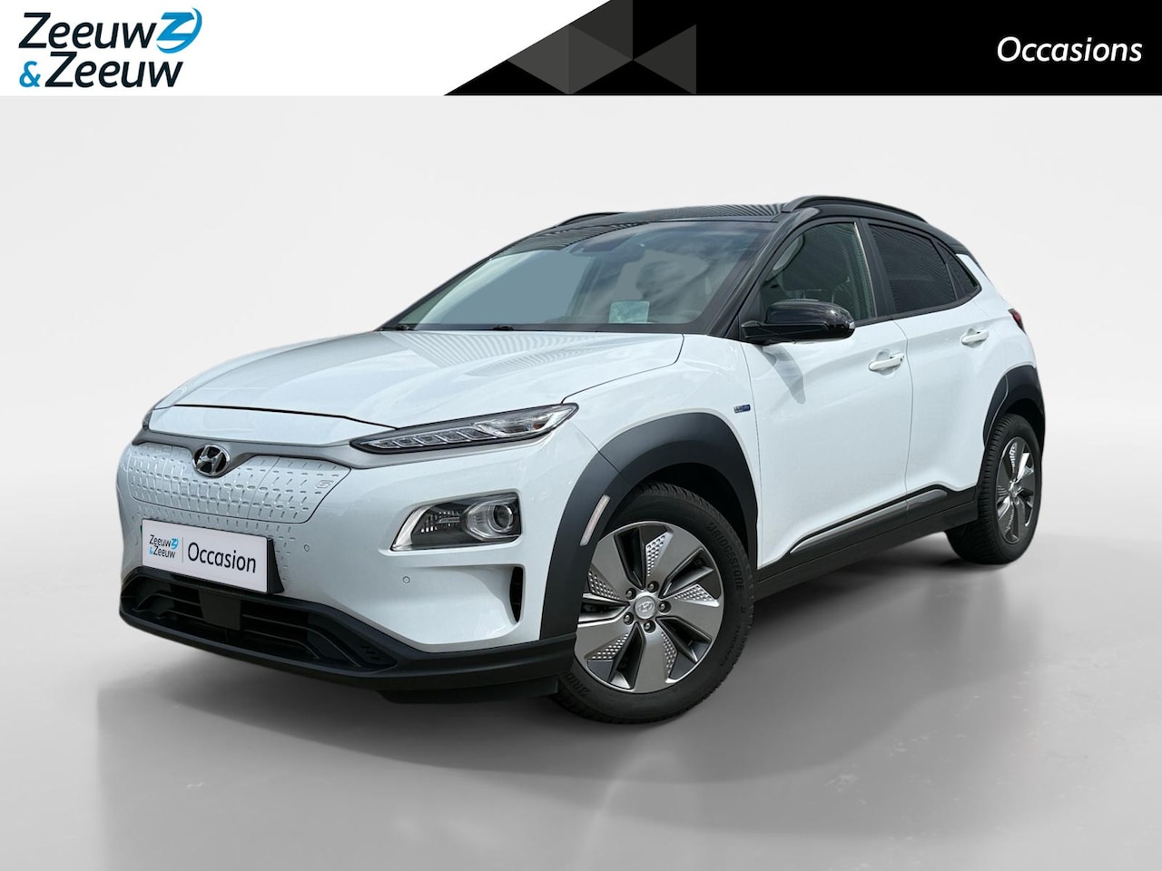 Hyundai Kona Electric - EV Premium 64 kWh | 99% SOH | Achteruitrijcamera | Head Up Display | Dodehoek Detectie | L - AutoWereld.nl
