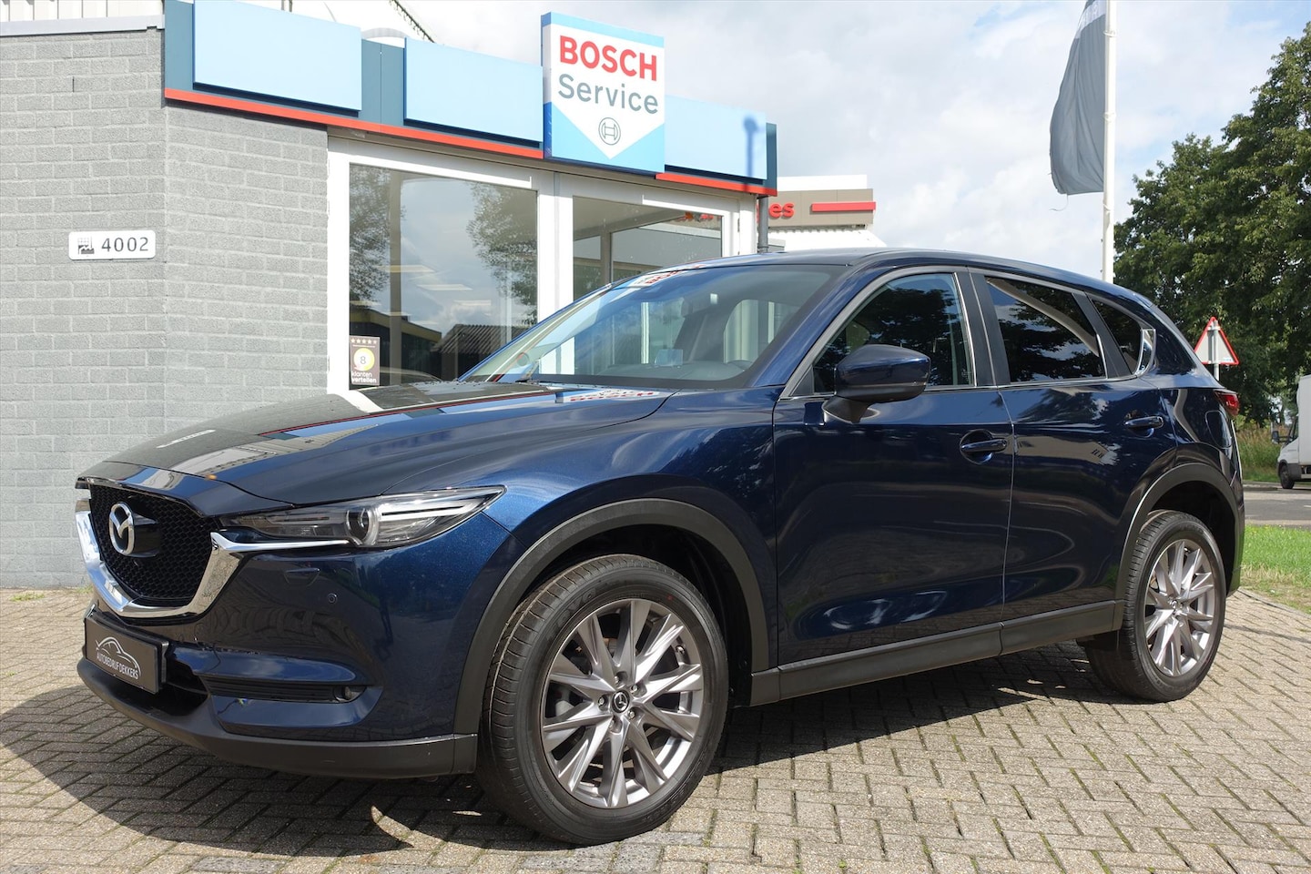 Mazda CX-5 - 2.0 SKYACTIV-G 165pk 2WD Skylease GT | HUD | 360 CAMERA | KEYLESS | ELEKTR ACHTERKLEP - AutoWereld.nl