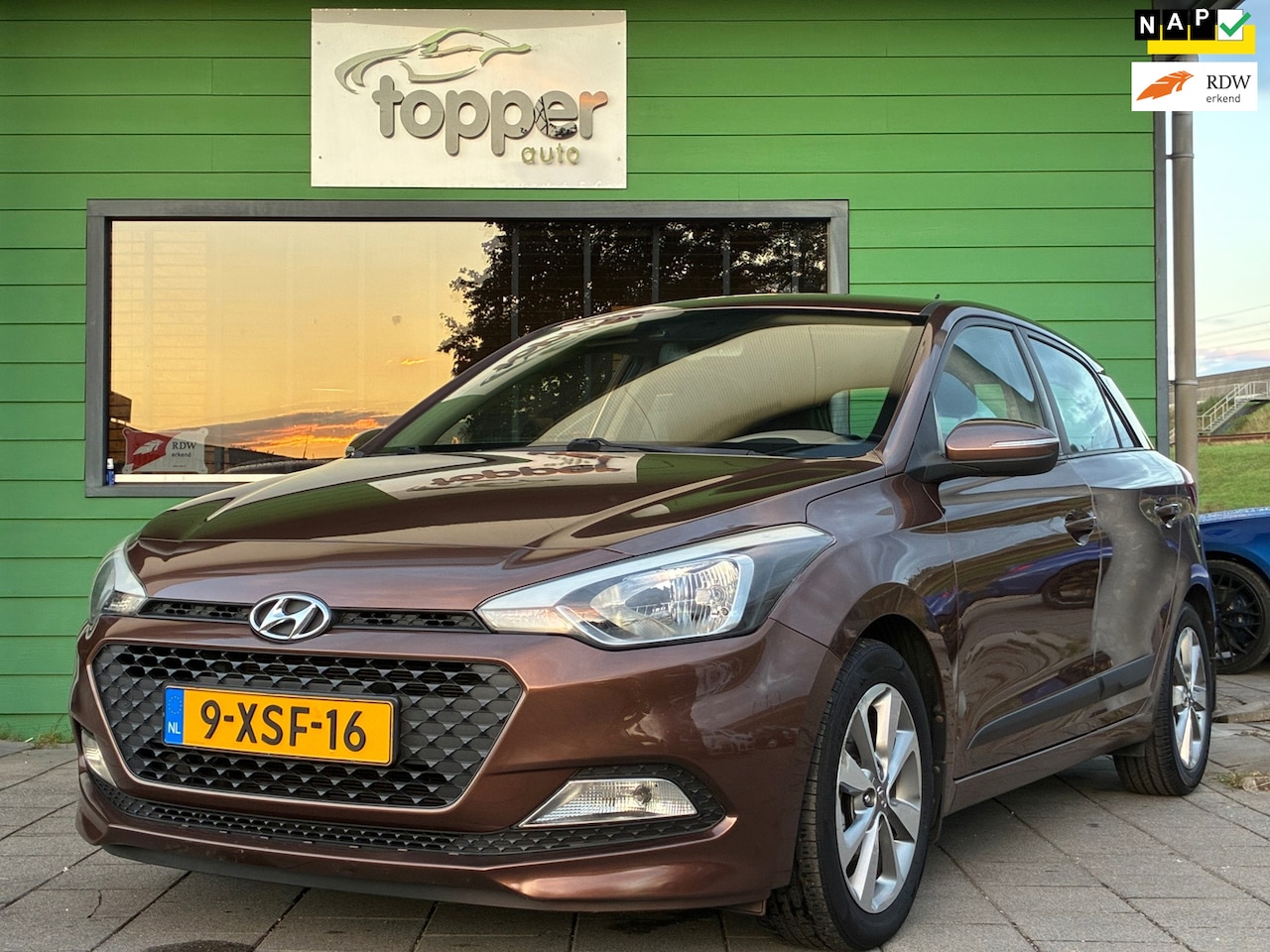 Hyundai i20 - 1.2 HP i-Motion Premium|1e Eigenaar|Airco|CruiseControl|Elektr.ramen|PDC|Nieuwe APK|NAP| - AutoWereld.nl